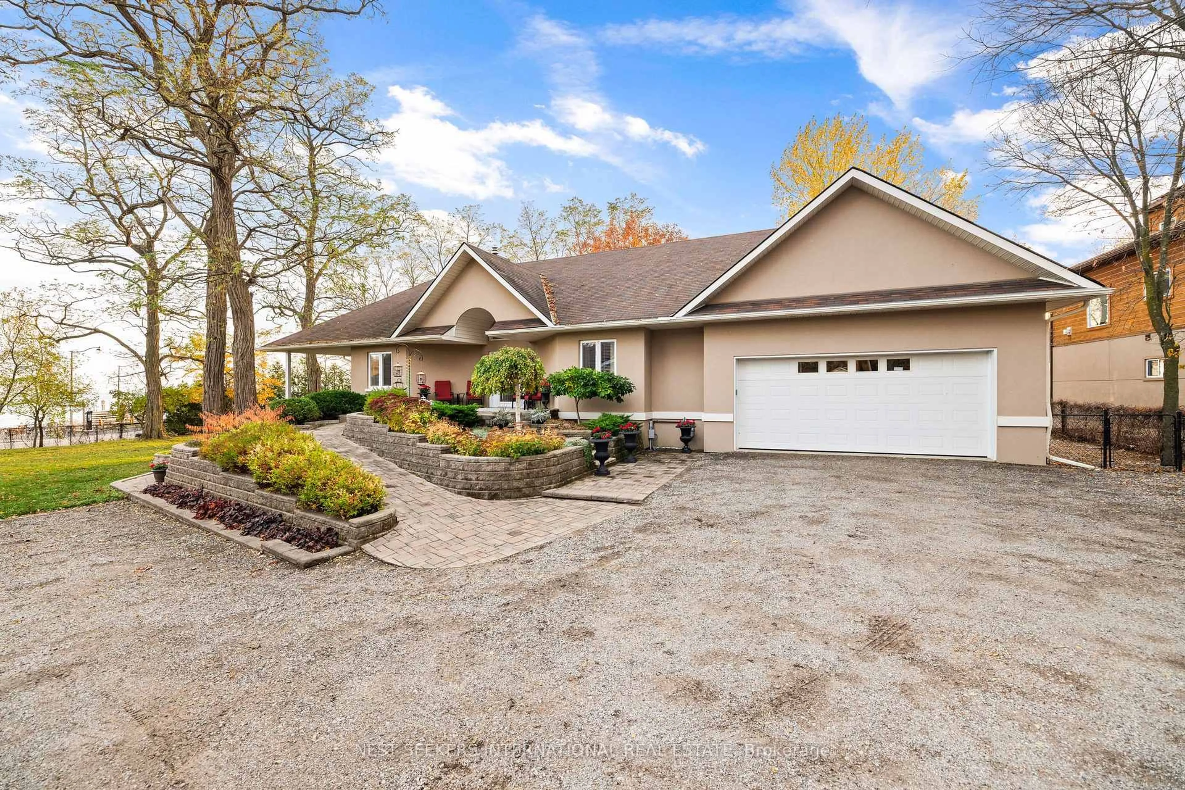 Home with vinyl exterior material, street for 20 Tiny Beaches Rd, Tiny Ontario L0L 2J0