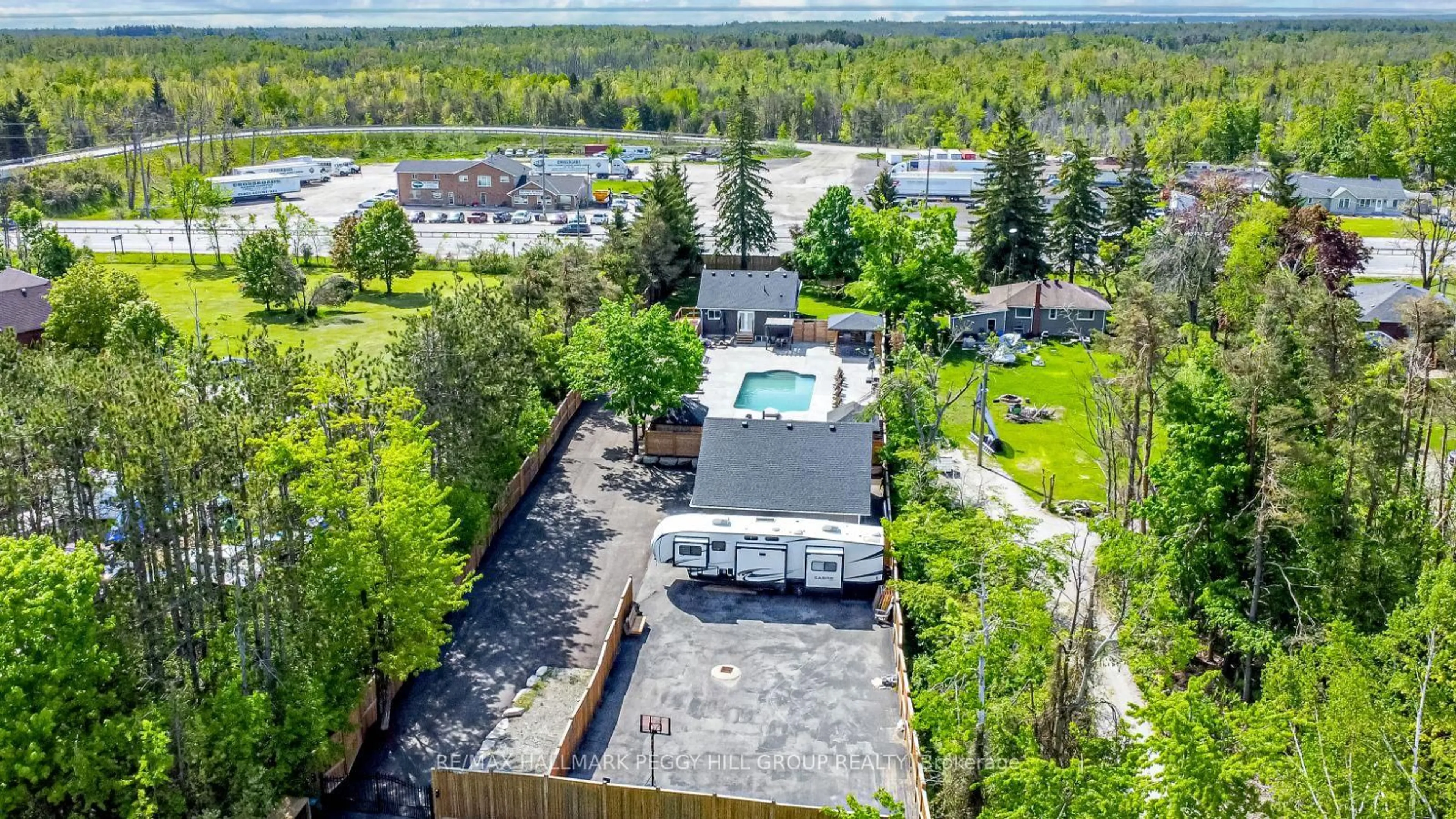 A pic from outside/outdoor area/front of a property/back of a property/a pic from drone, unknown for 2484 Highway 11, Oro-Medonte Ontario L0L 2E0