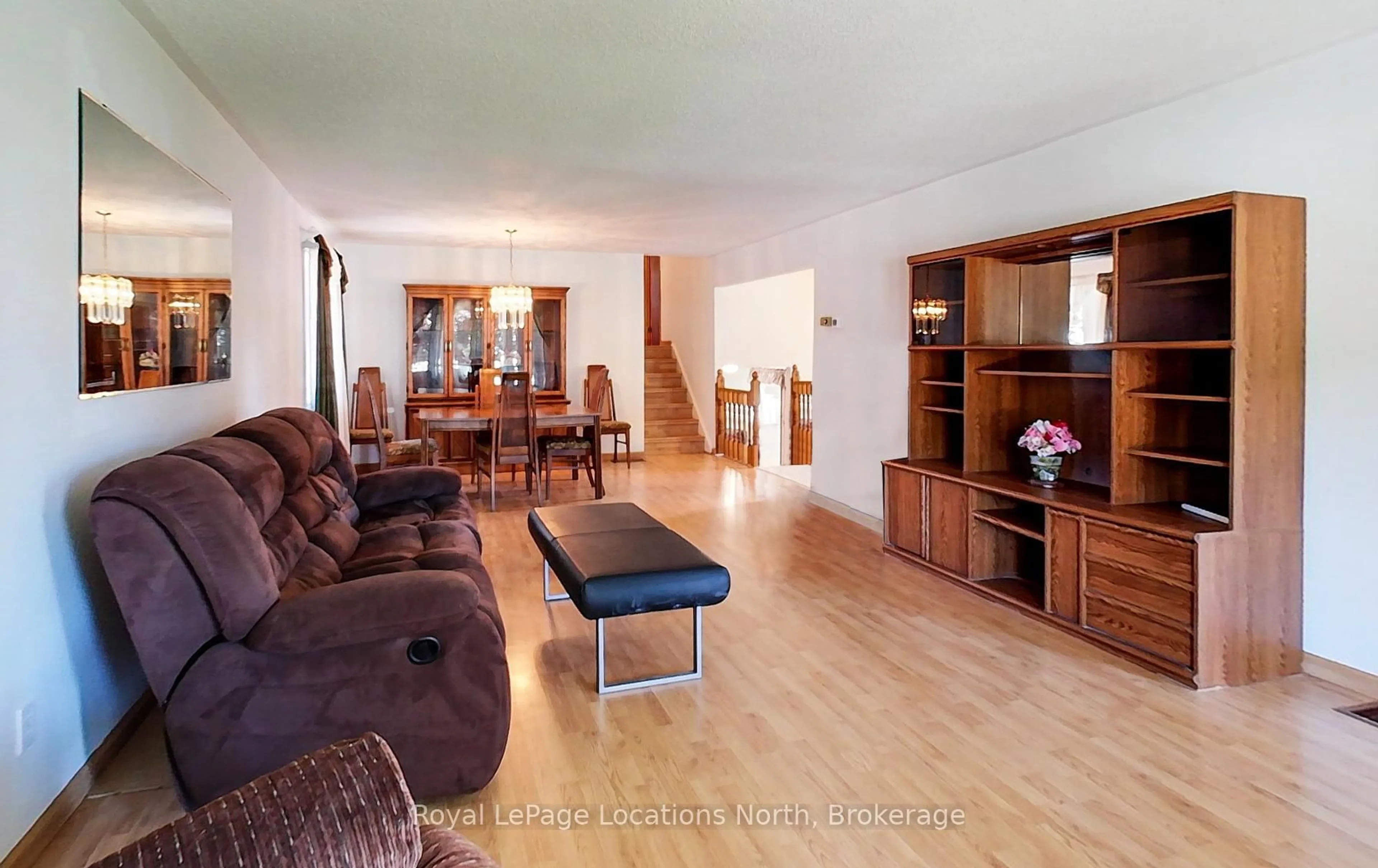 Living room with furniture, wood/laminate floor for 221 John St, Clearview Ontario L0M 1S0