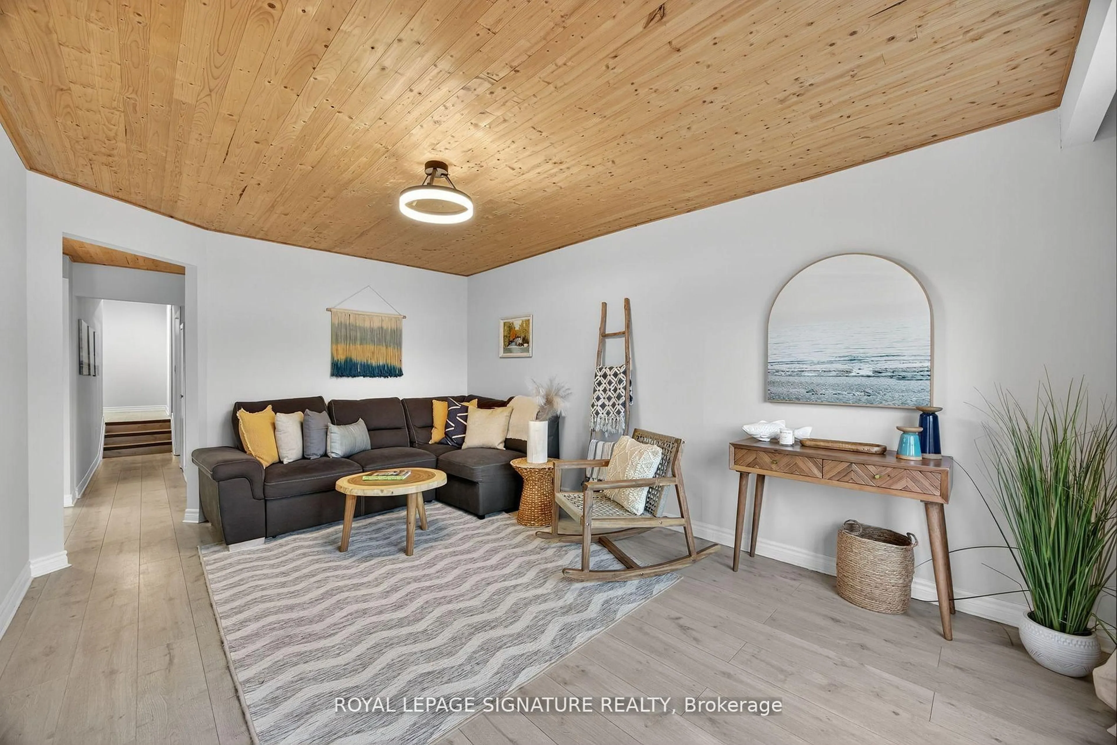 Living room with furniture, wood/laminate floor for 57 Maria St, Penetanguishene Ontario L9M 1L3