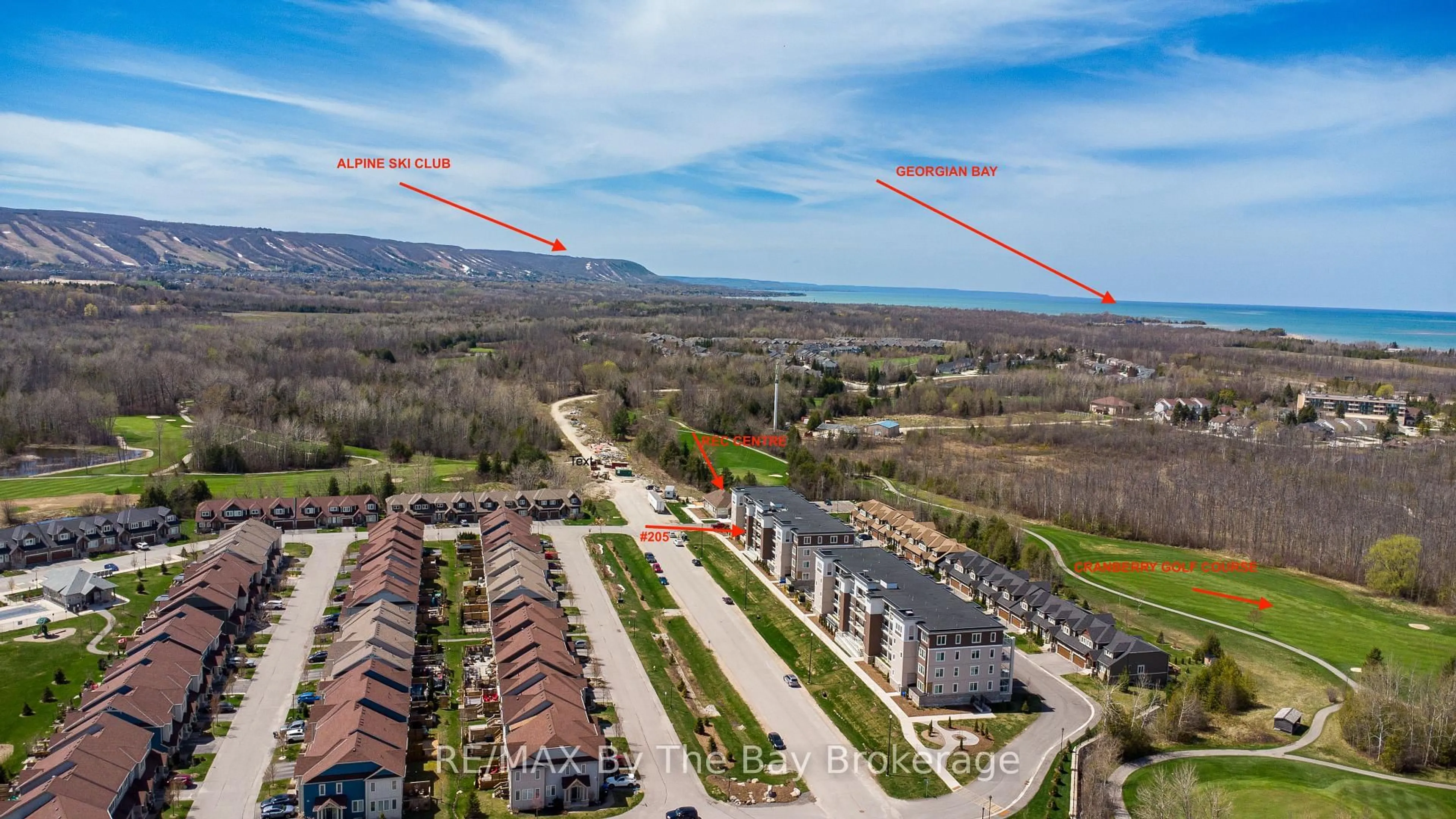 A pic from outside/outdoor area/front of a property/back of a property/a pic from drone, water/lake/river/ocean view for 17 Spooner Cres #205, Collingwood Ontario L9Y 1T3