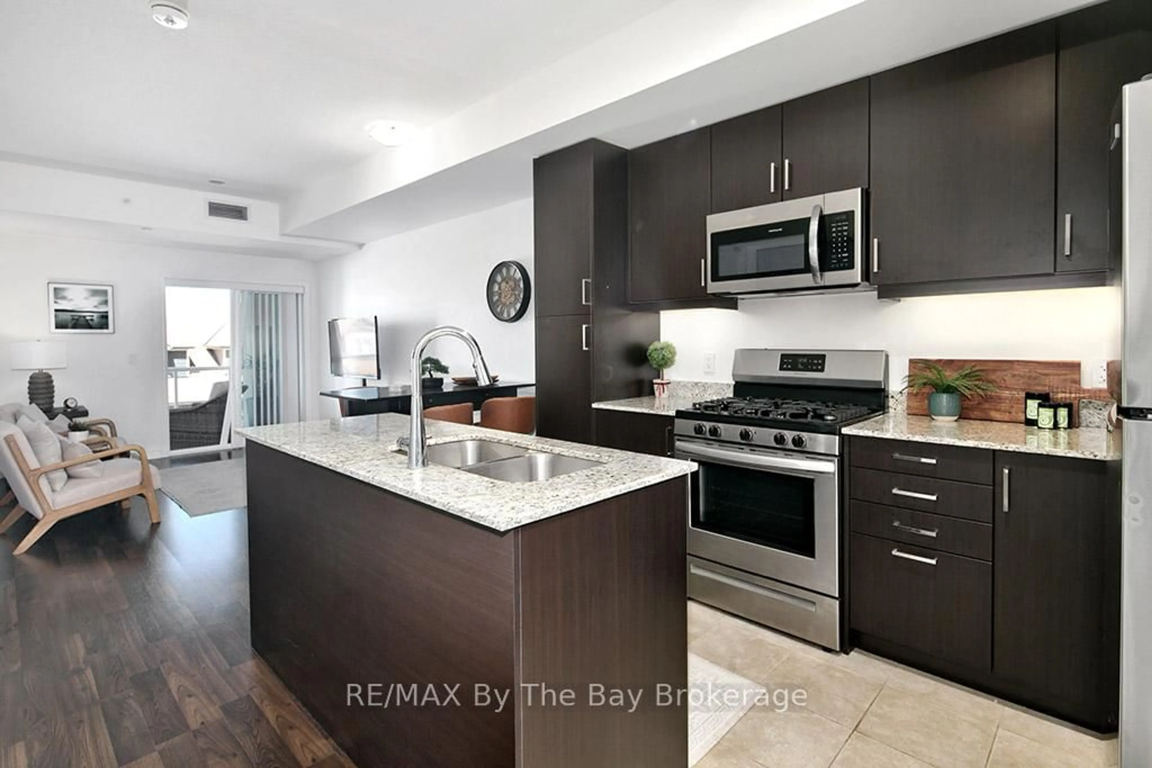 Open concept kitchen, ceramic/tile floor for 17 Spooner Cres #205, Collingwood Ontario L9Y 1T3