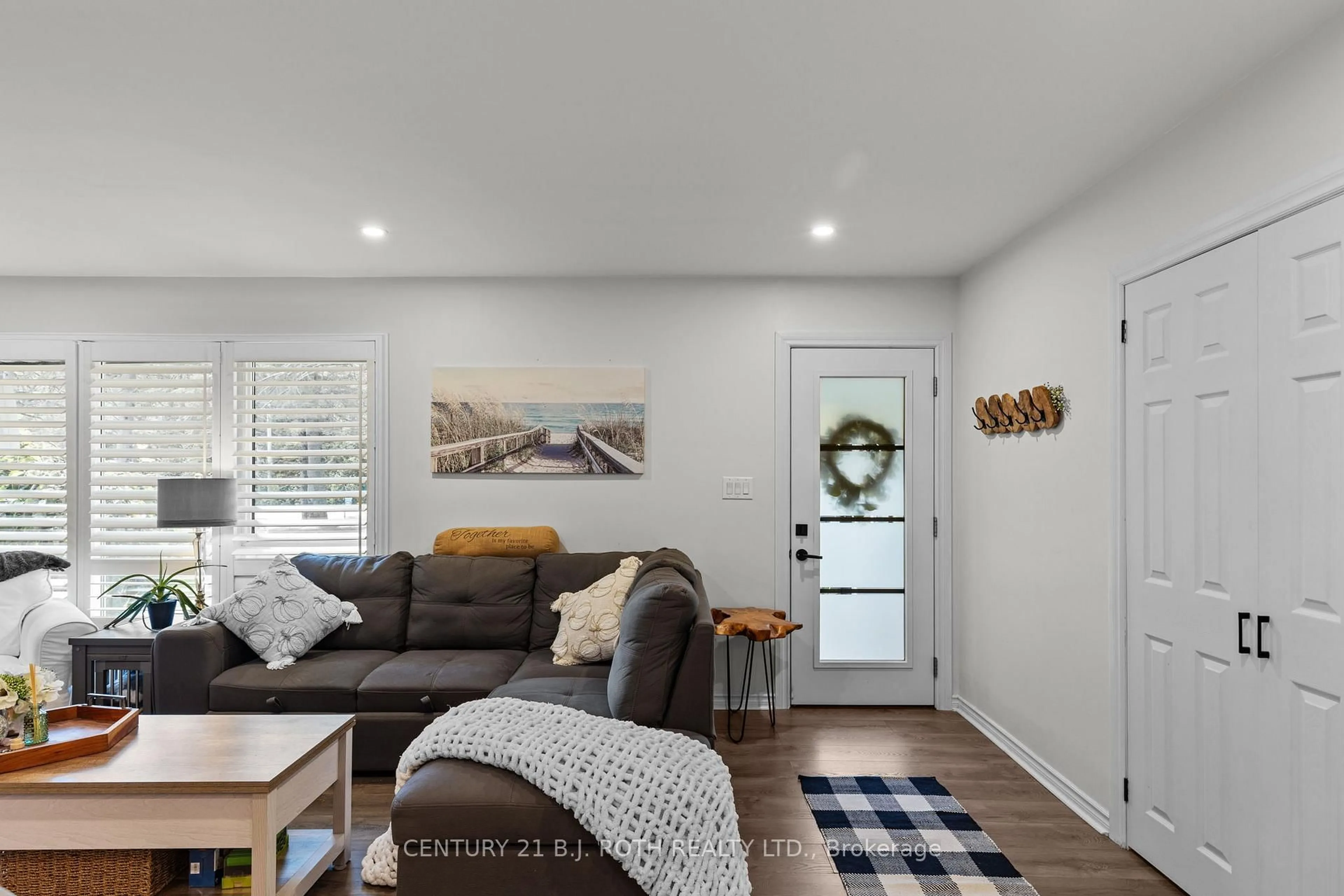 Living room with furniture, wood/laminate floor for 1551 GILL Rd, Springwater Ontario L0L 1X0