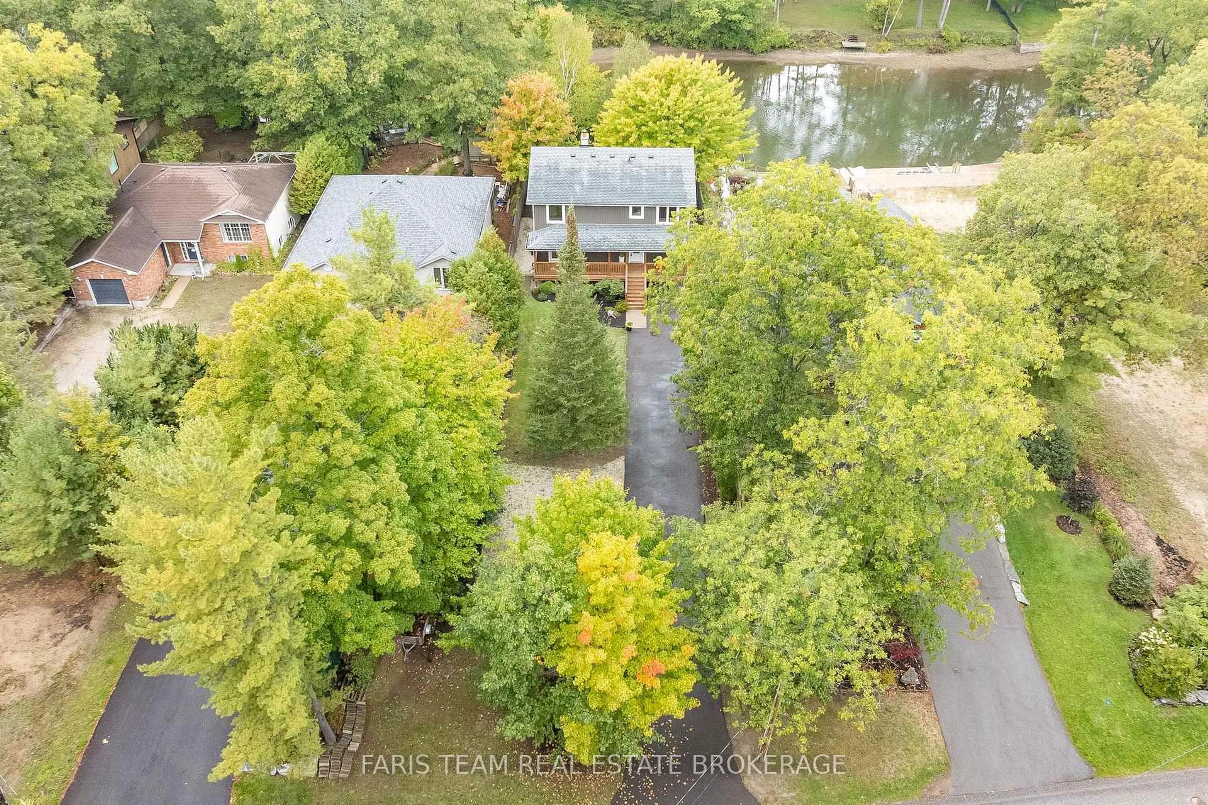 A pic from outside/outdoor area/front of a property/back of a property/a pic from drone, forest/trees view for 104 Knox Rd, Wasaga Beach Ontario L9Z 2T5