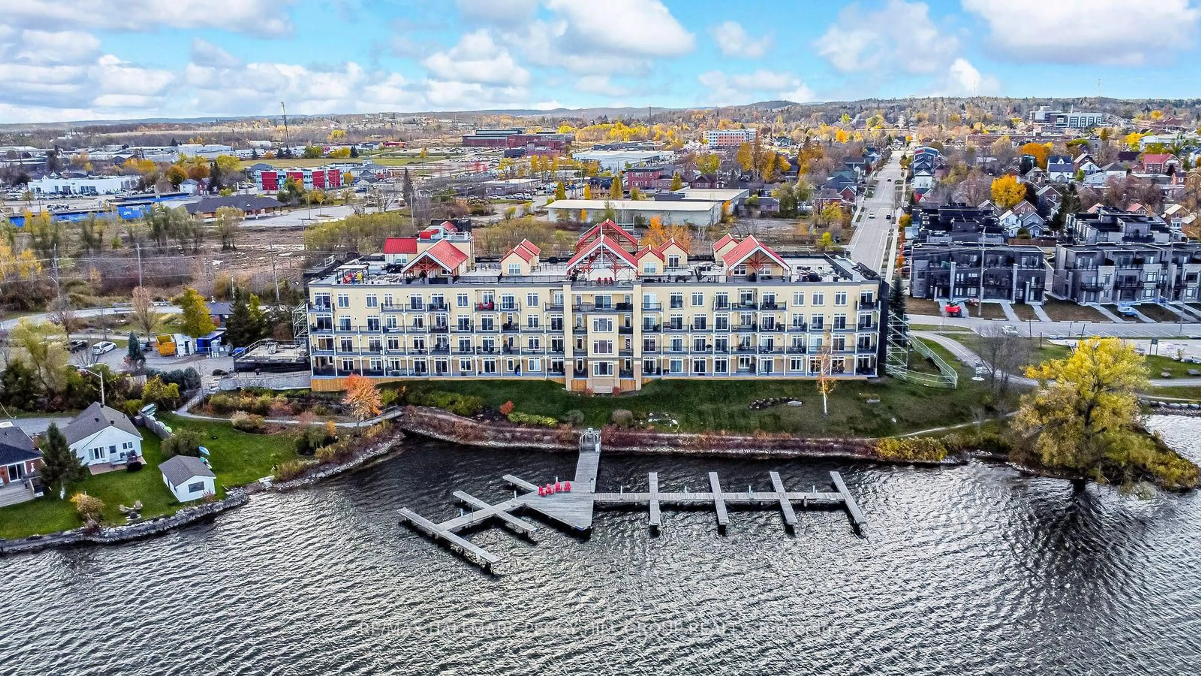 A pic from outside/outdoor area/front of a property/back of a property/a pic from drone, water/lake/river/ocean view for 140 Cedar Island Rd #401, Orillia Ontario L3V 1T1