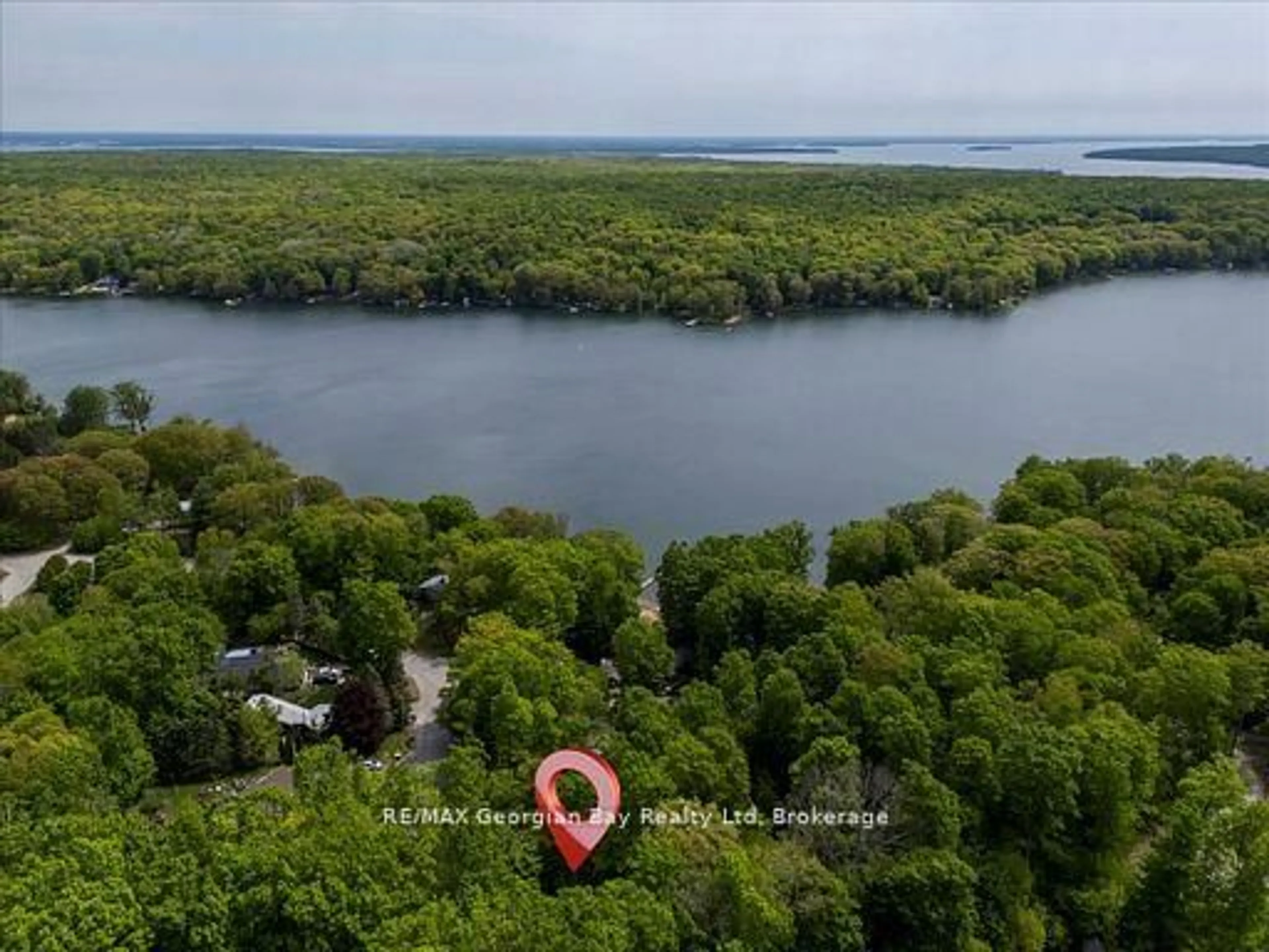 A pic from outside/outdoor area/front of a property/back of a property/a pic from drone, water/lake/river/ocean view for 31 Lakeview Cres, Tiny Ontario L9M 1R2