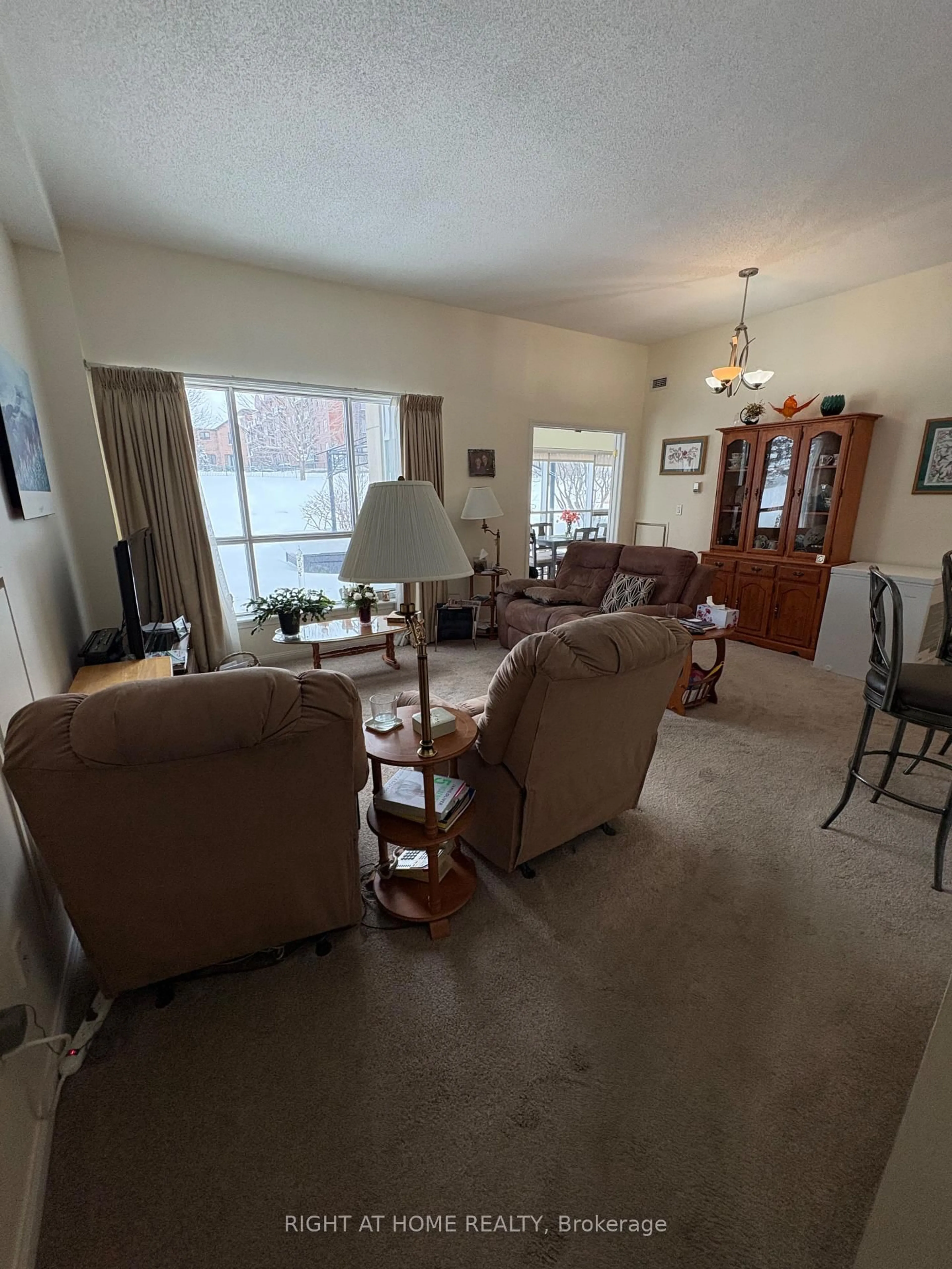 Living room with furniture, floor is not visible for 94 Dean Ave #109, Barrie Ontario L4N 0M3