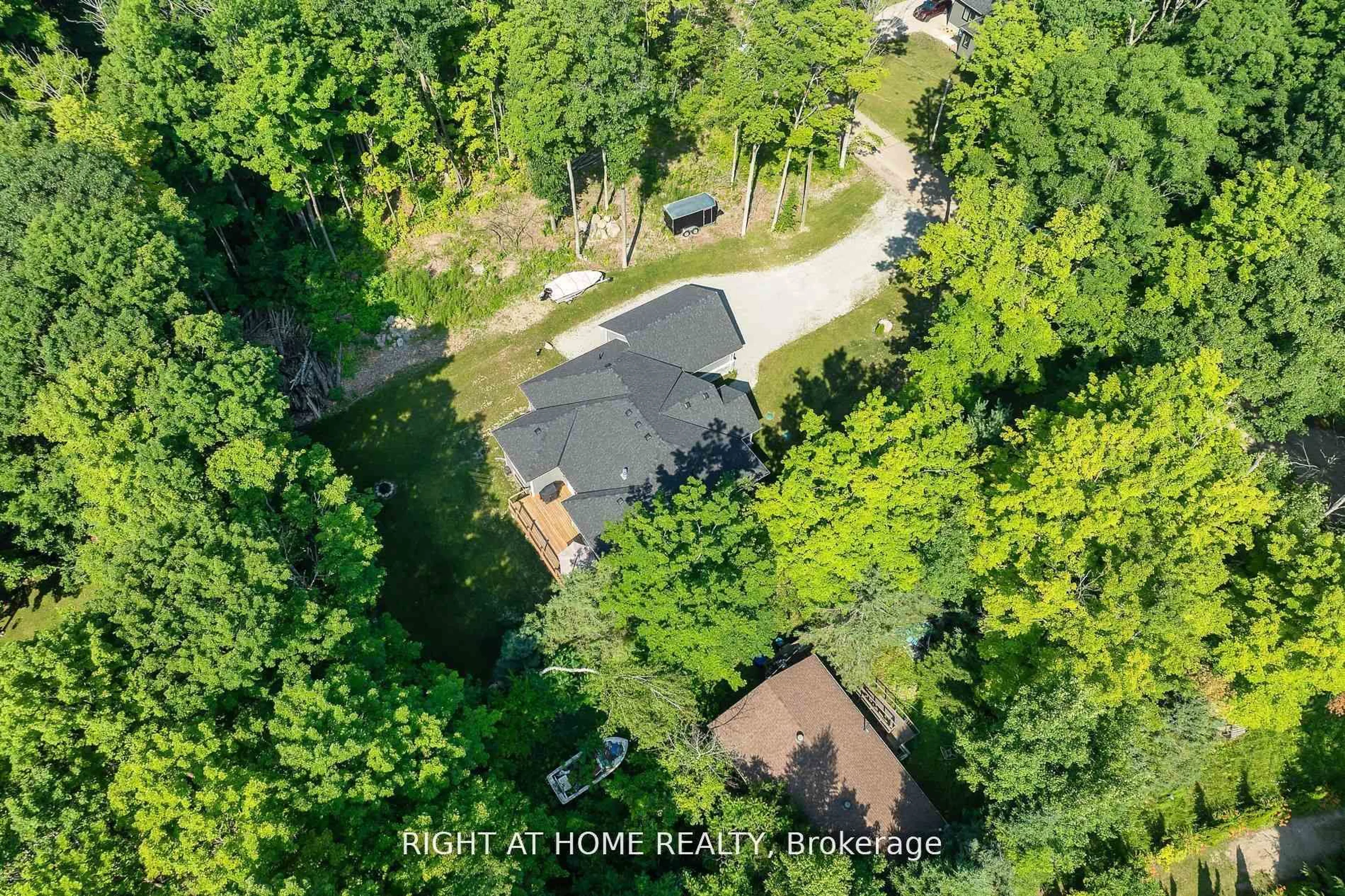 A pic from outside/outdoor area/front of a property/back of a property/a pic from drone, forest/trees view for 9 Fairlawn Grve, Tiny Ontario L9M 0B5