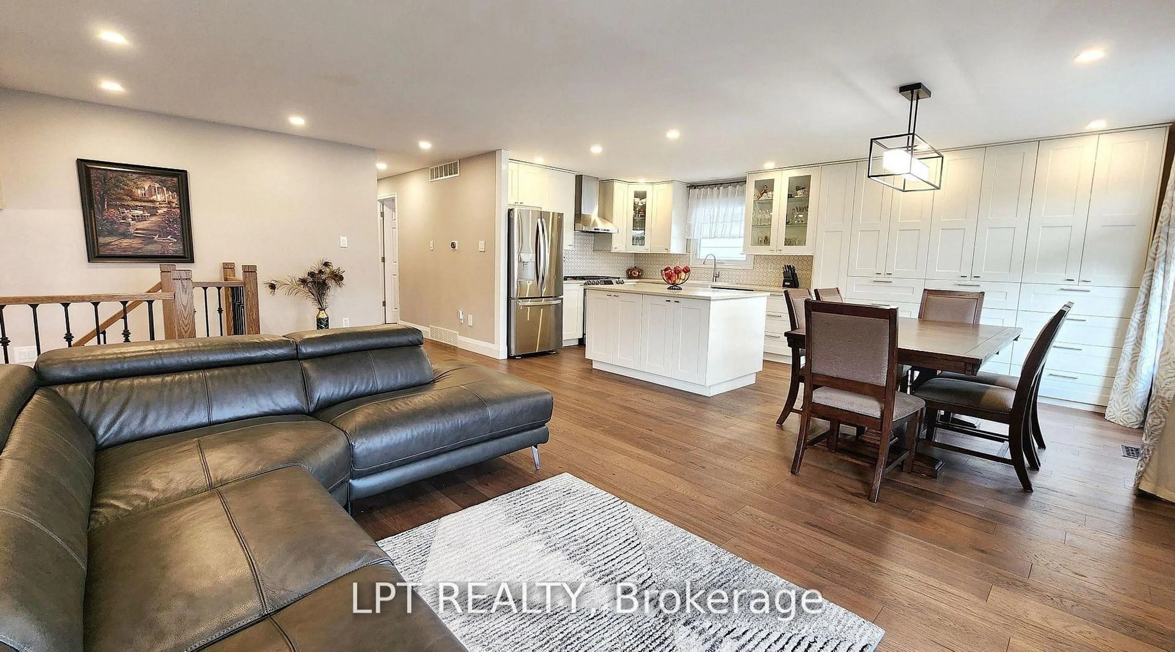 Open concept kitchen, wood/laminate floor for 48 Maplehurst Cres, Barrie Ontario L4M 4X2