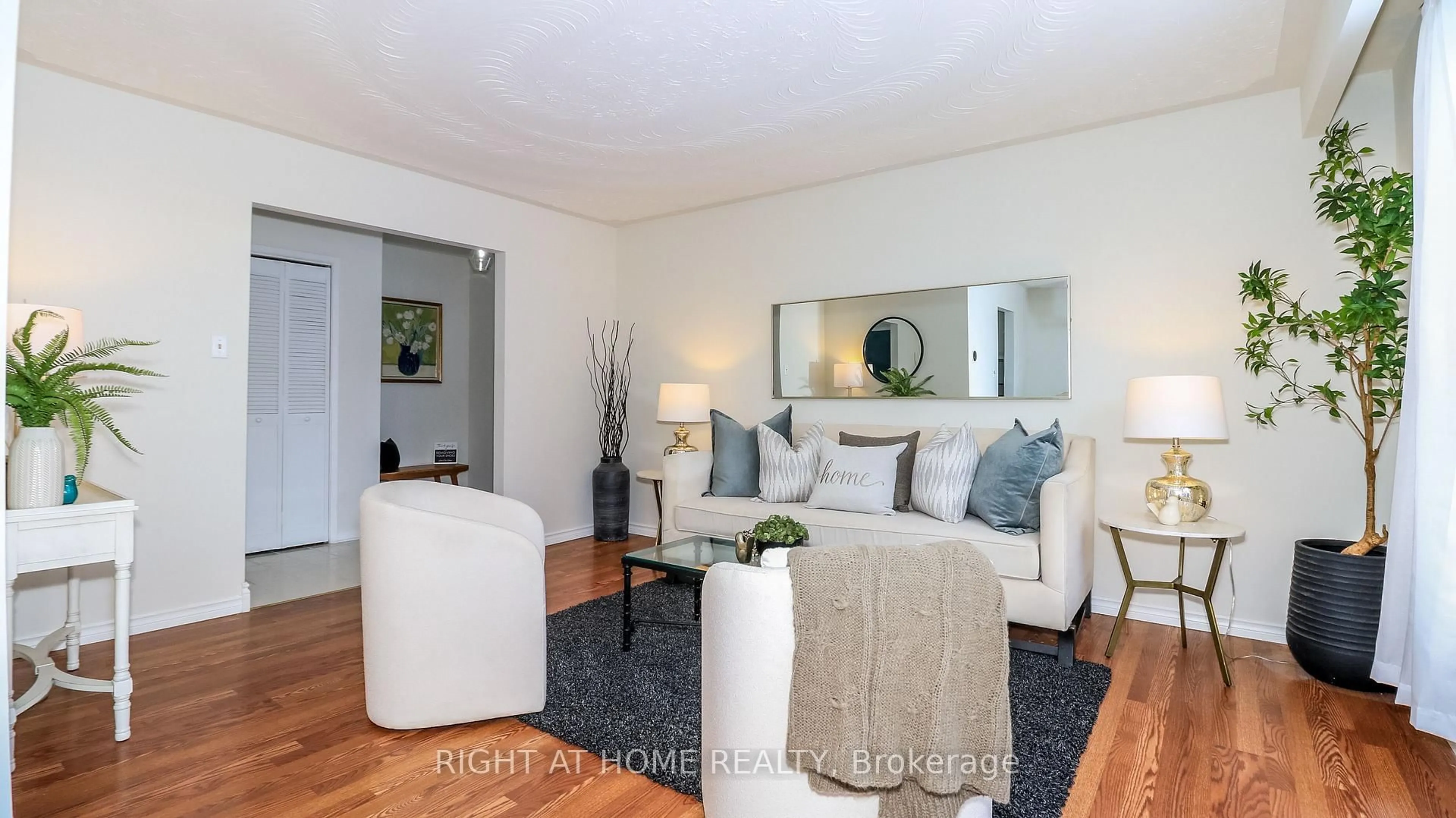 Living room with furniture, wood/laminate floor for 1059 Glen Mhor Cres, Midland Ontario L4R 4P5