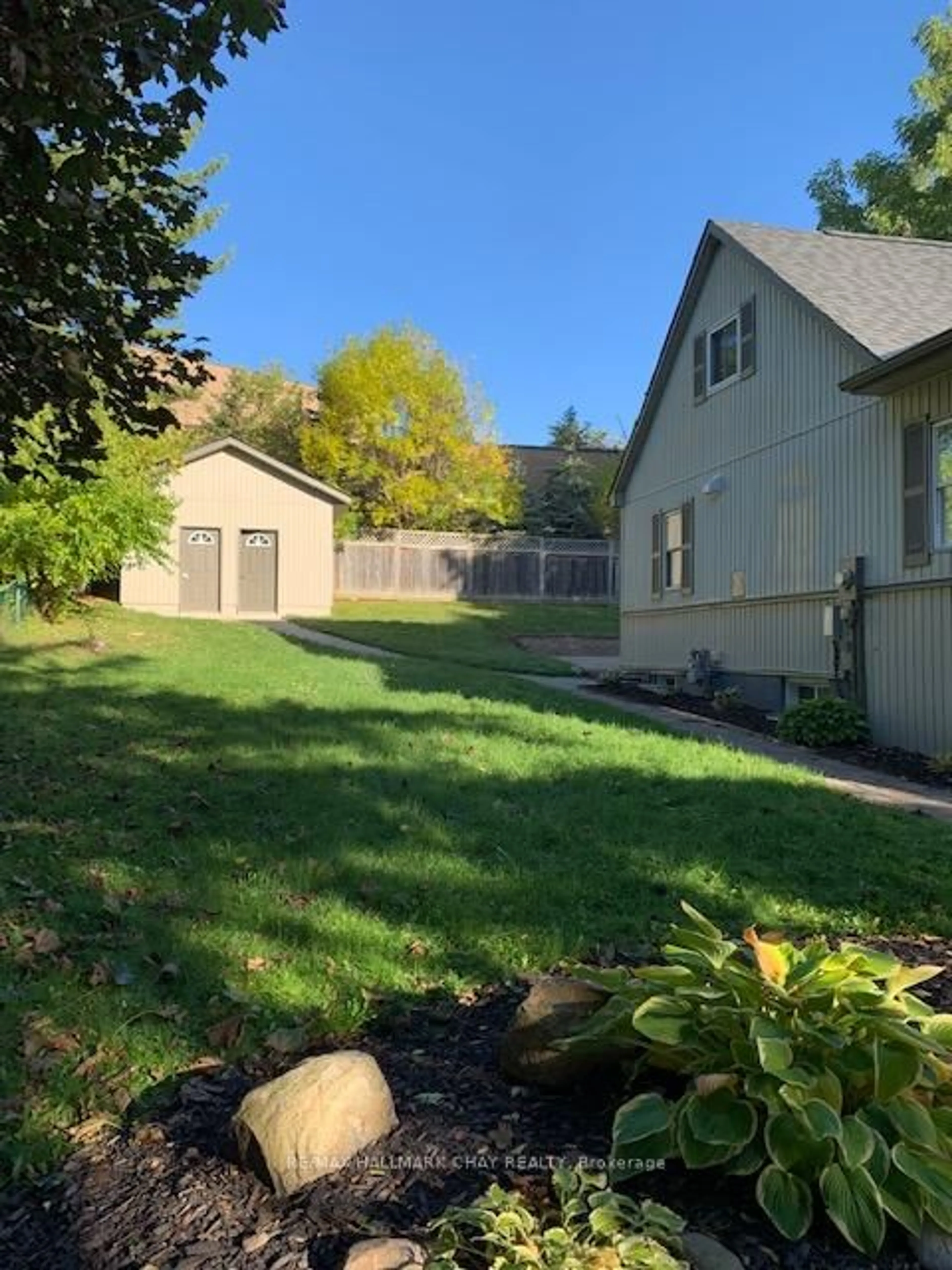 A pic from outside/outdoor area/front of a property/back of a property/a pic from drone, street for 32 Grove St #1, 2, 3, Barrie Ontario L4N 1M7