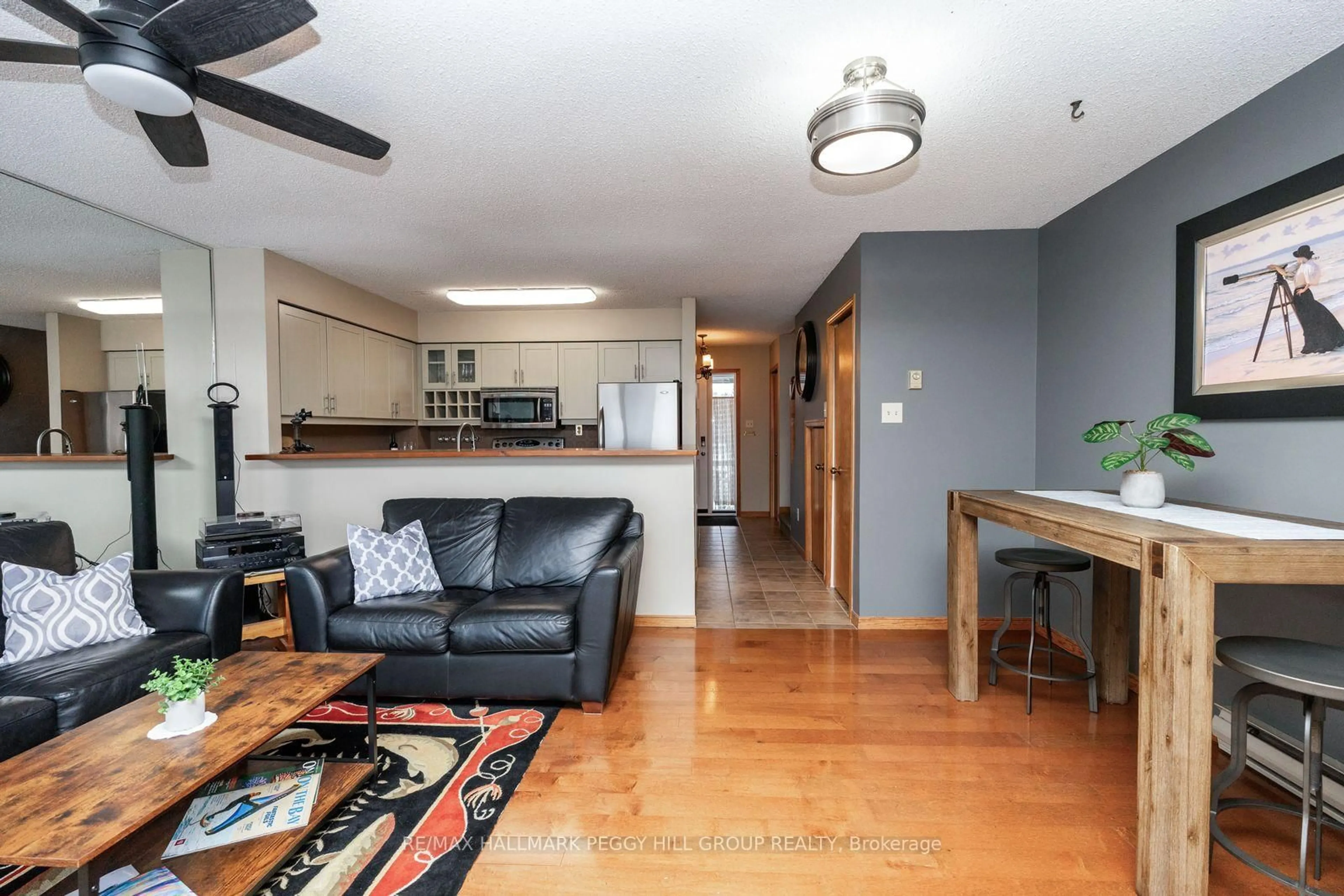 Living room with furniture, wood/laminate floor for 8 Ramblings Way #121, Collingwood Ontario L9Y 5S3