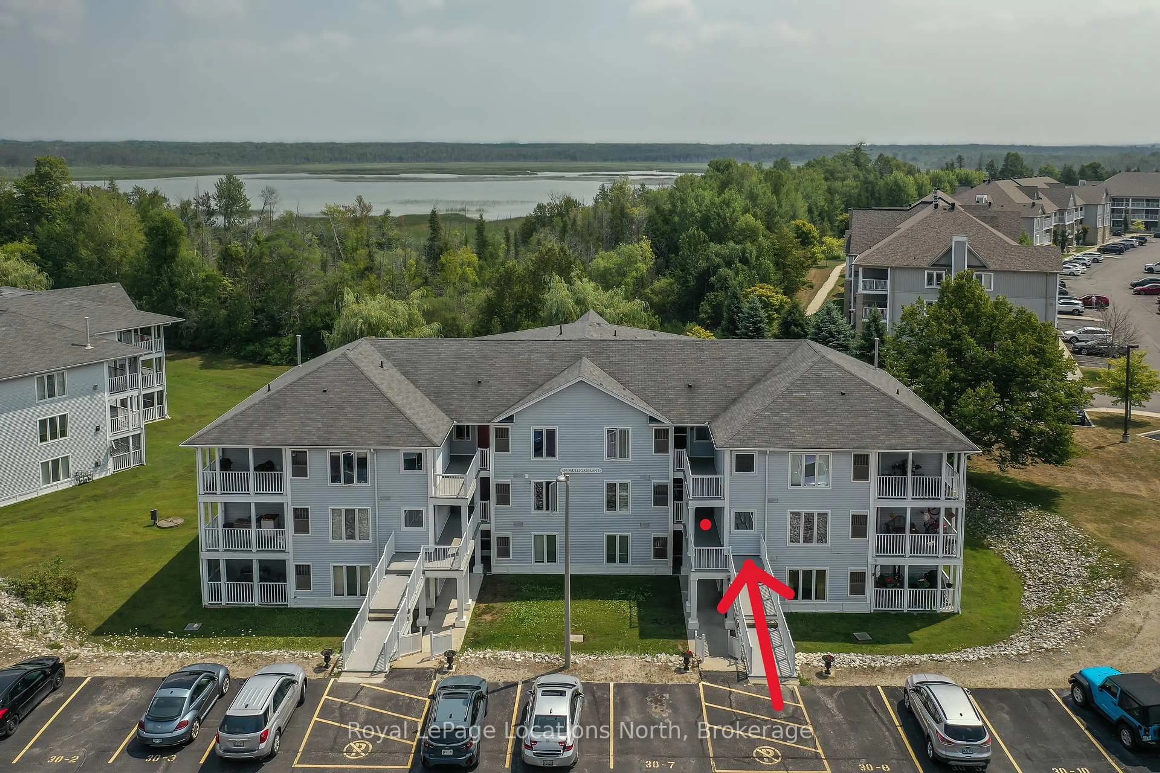 A pic from outside/outdoor area/front of a property/back of a property/a pic from drone, water/lake/river/ocean view for 30 Mulligan Lane #8, Wasaga Beach Ontario L9Z 1C4