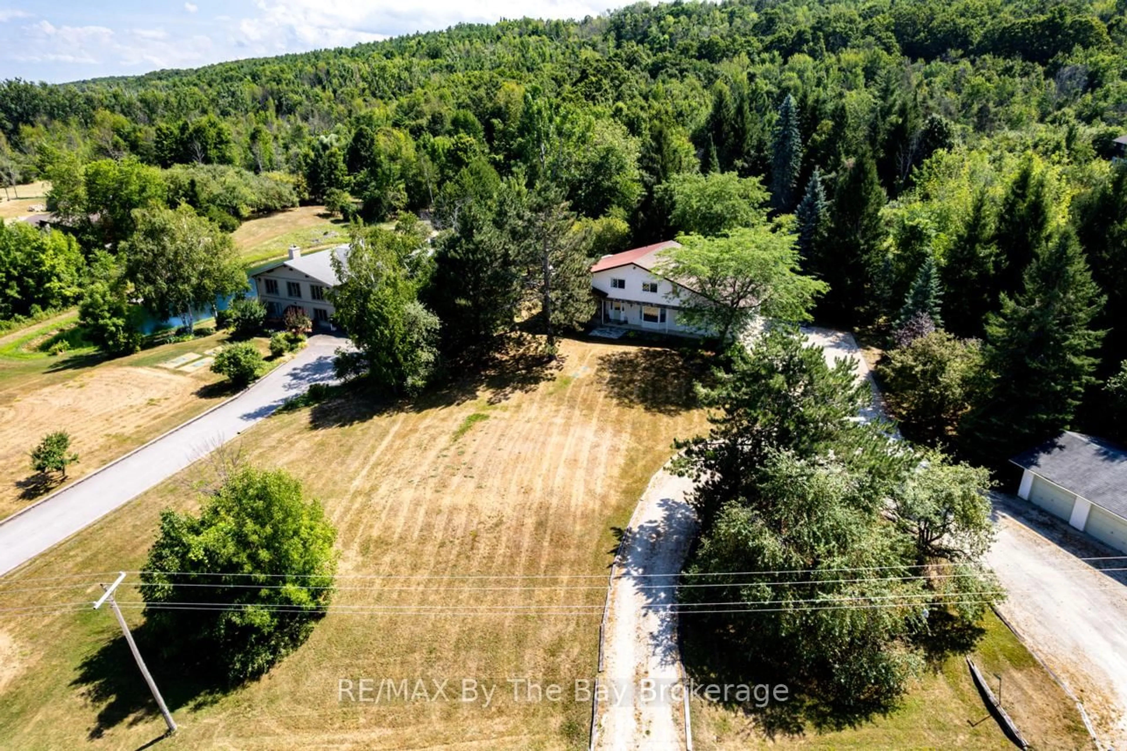 A pic from outside/outdoor area/front of a property/back of a property/a pic from drone, forest/trees view for 8223 30/31 Sdrd, Clearview Ontario L0M 1P0