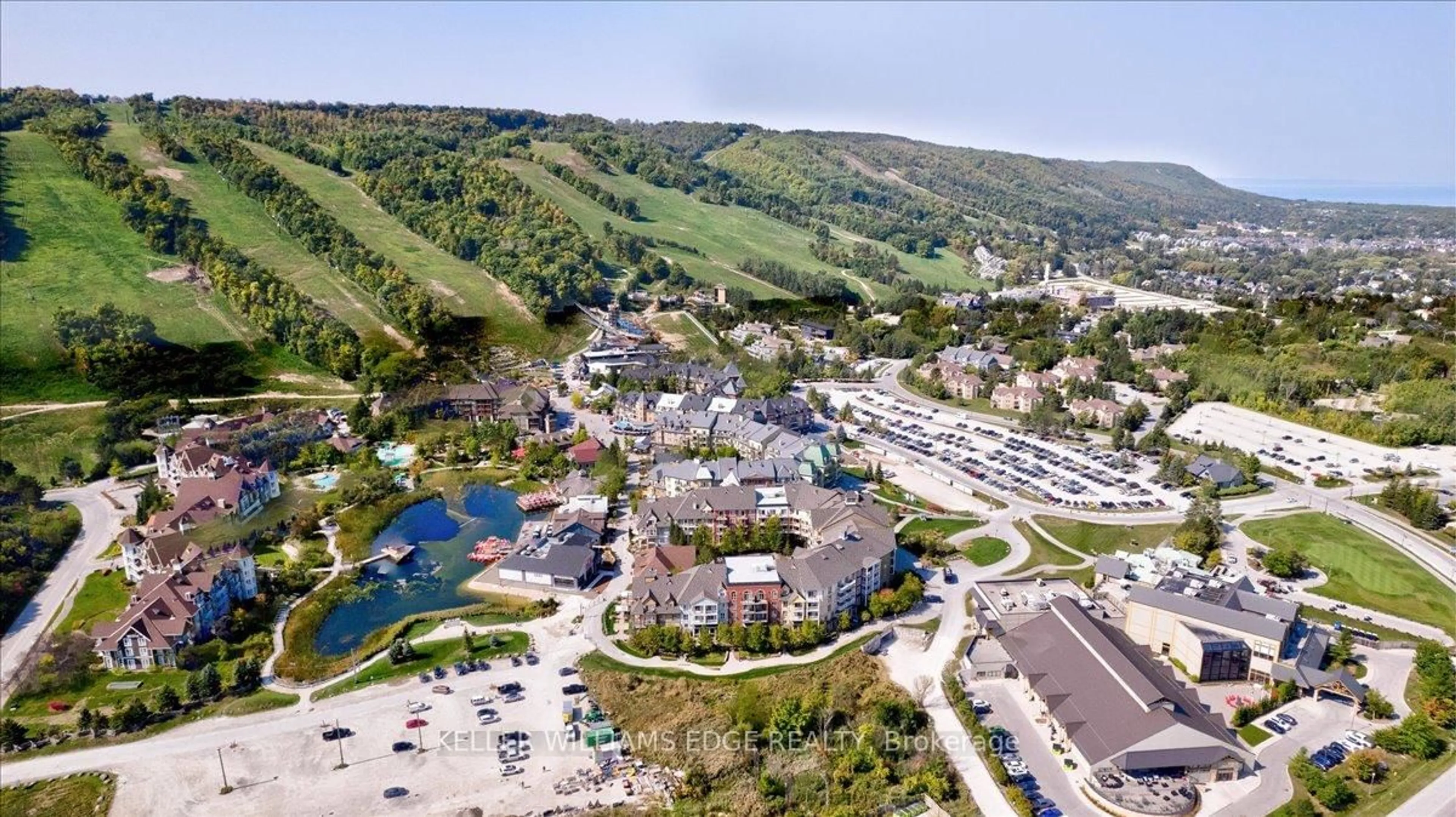 A pic from outside/outdoor area/front of a property/back of a property/a pic from drone, mountain view for 1 Hume St #216, Collingwood Ontario L9Y 0X3