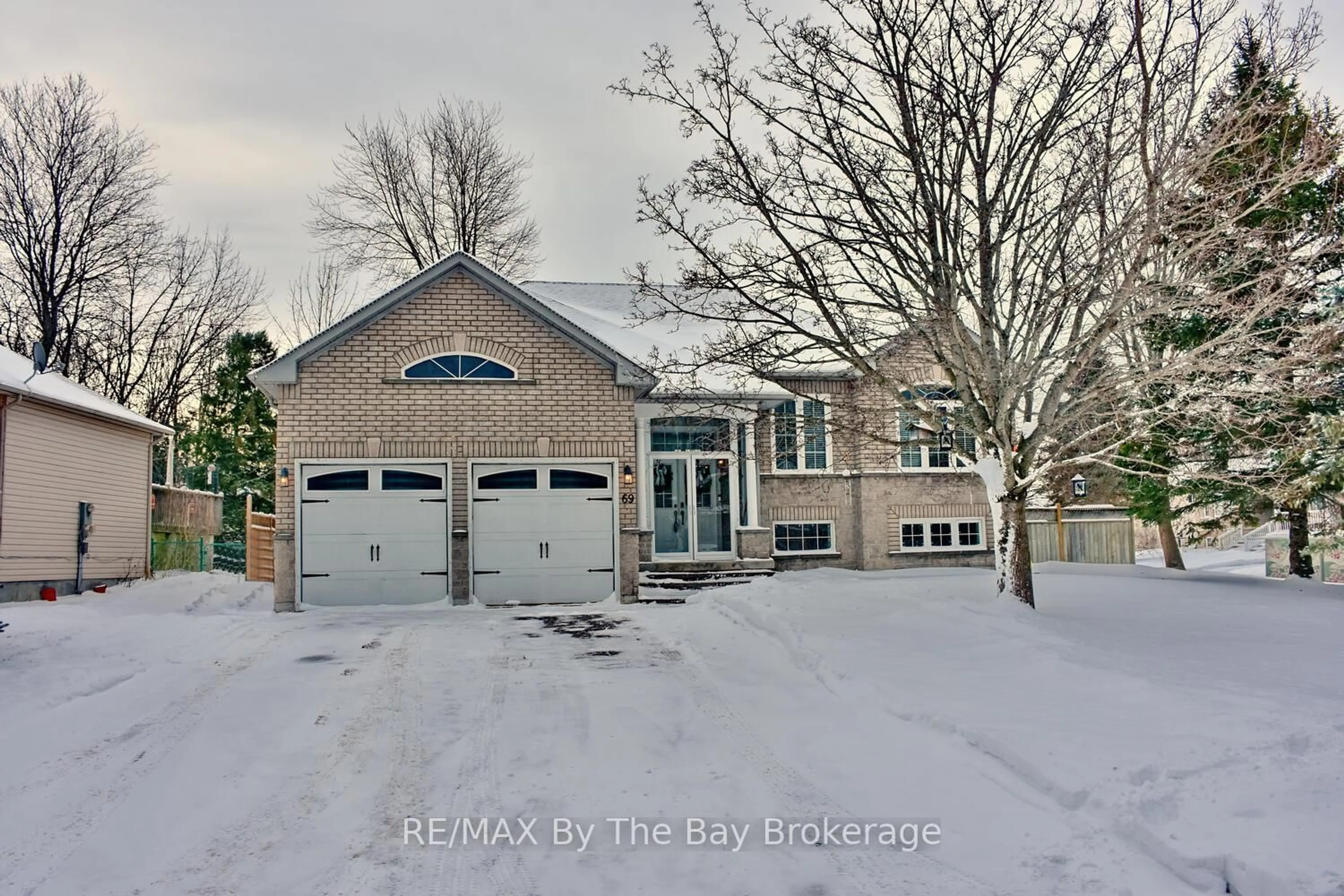 Home with brick exterior material, street for 69 Caribou Tr, Wasaga Beach Ontario L9Z 1N3