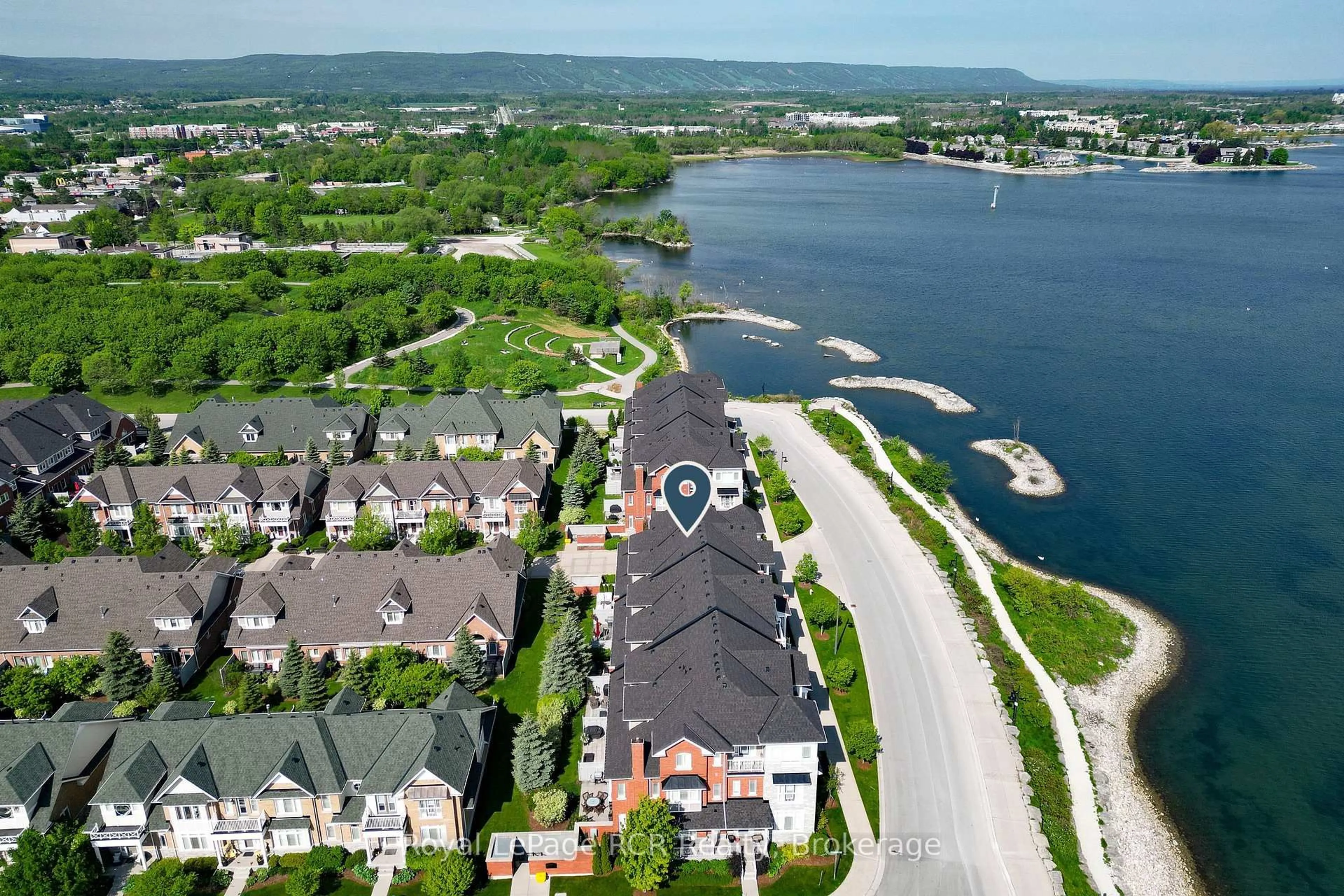 A pic from outside/outdoor area/front of a property/back of a property/a pic from drone, water/lake/river/ocean view for 16 Wheelhouse Cres, Collingwood Ontario L9Y 0J9