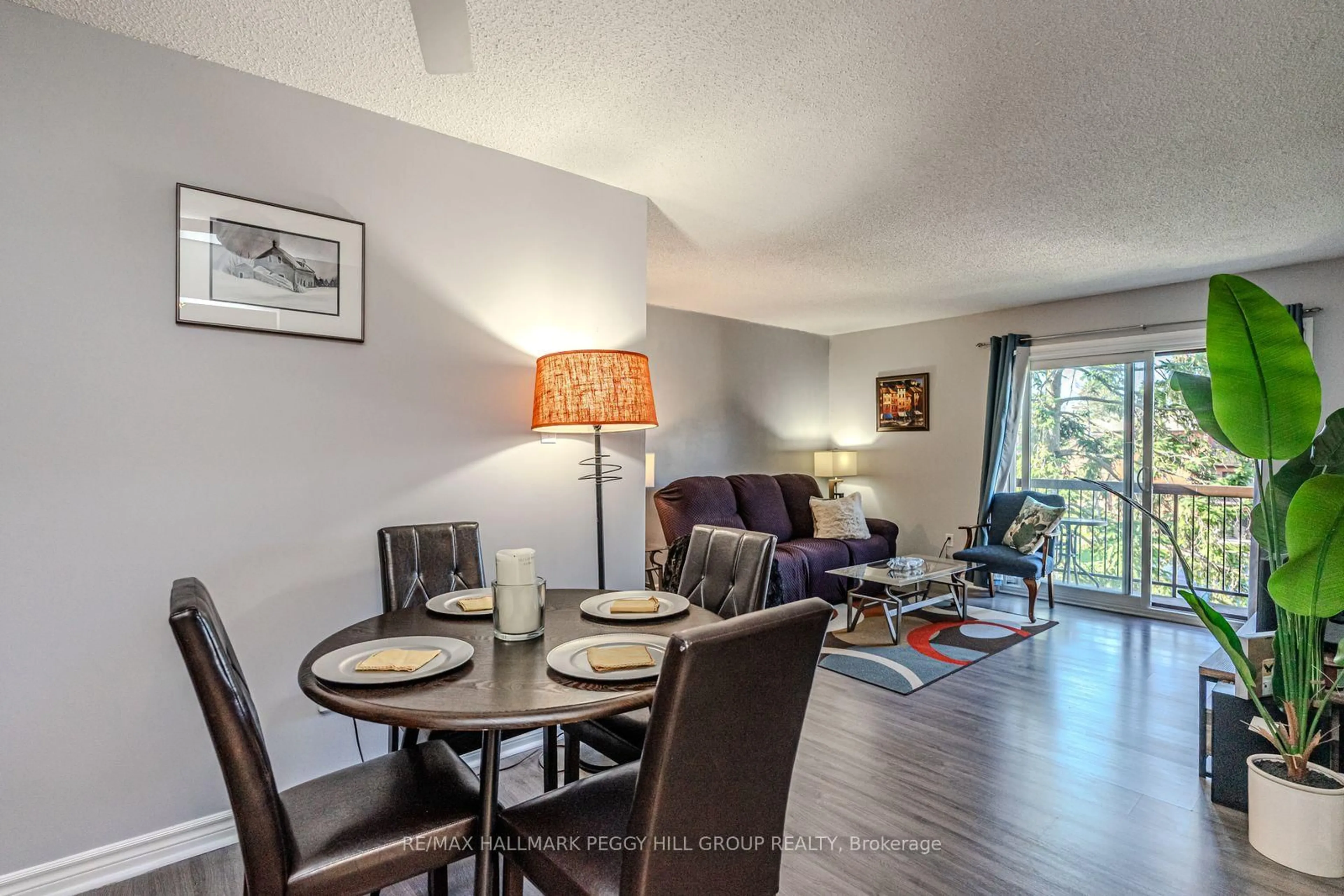 Living room with furniture, wood/laminate floor for 167 Edgehill Dr #E9, Barrie Ontario L4N 1L9