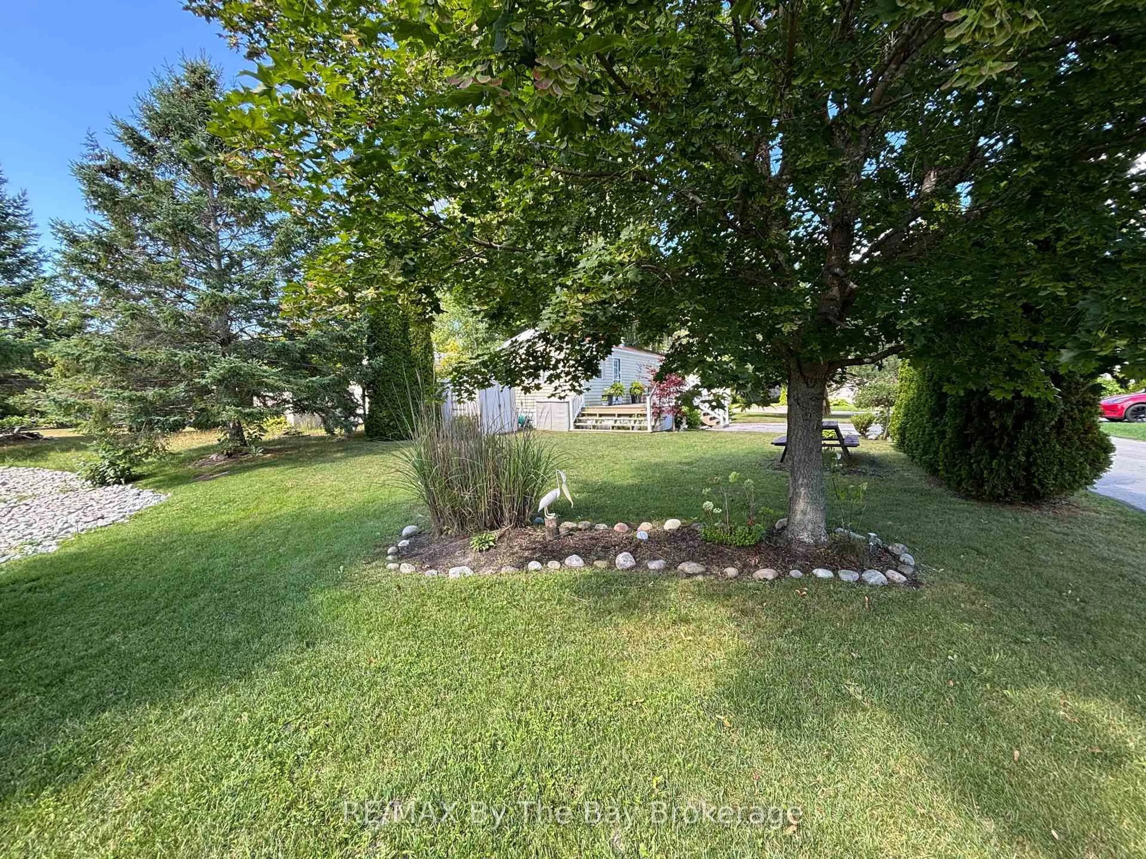 A pic from outside/outdoor area/front of a property/back of a property/a pic from drone, forest/trees view for 15 Huron Circ, Wasaga Beach Ontario L9Z 1X7