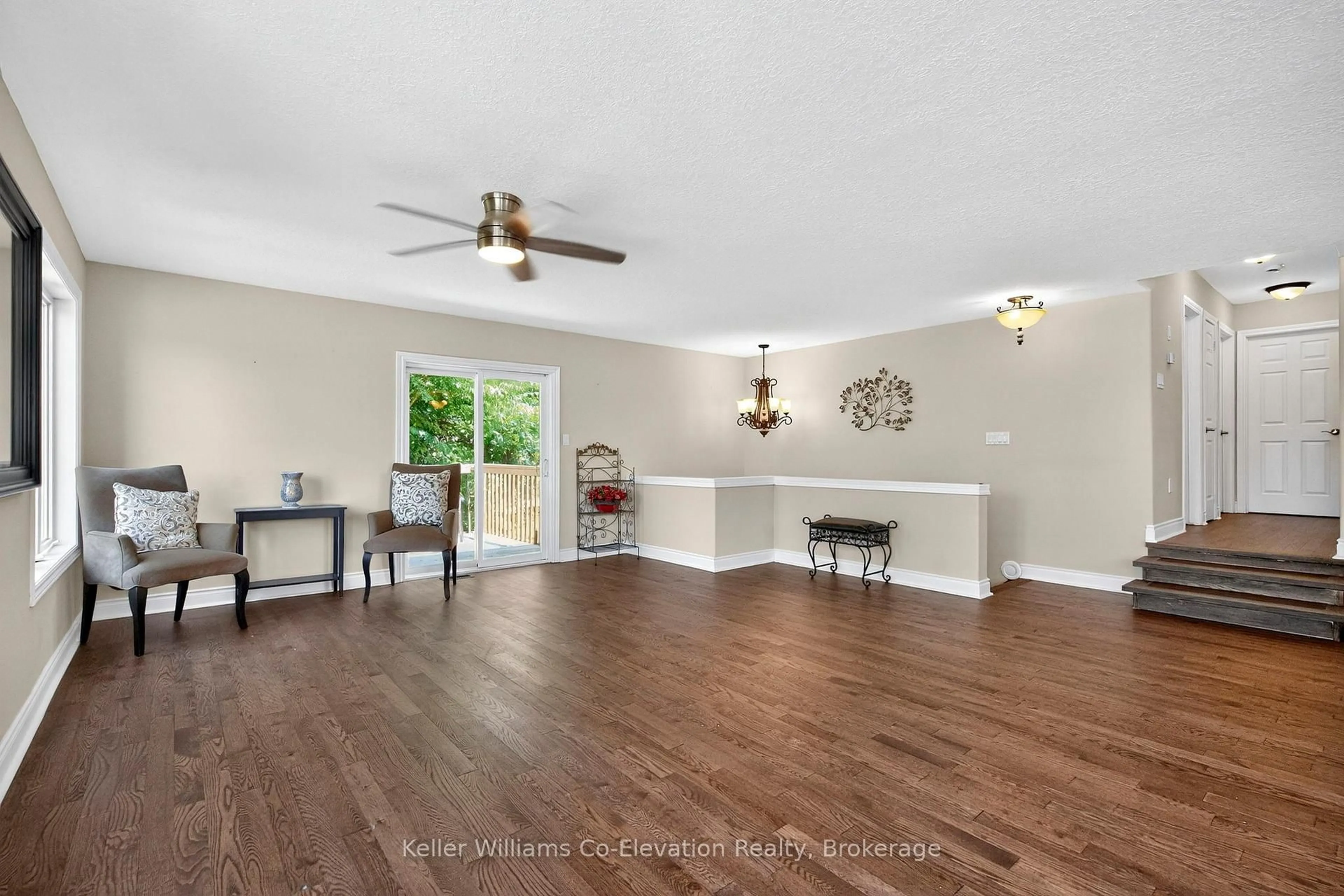 Living room with furniture, wood/laminate floor for 423 Irwin St, Midland Ontario L4R 2V6