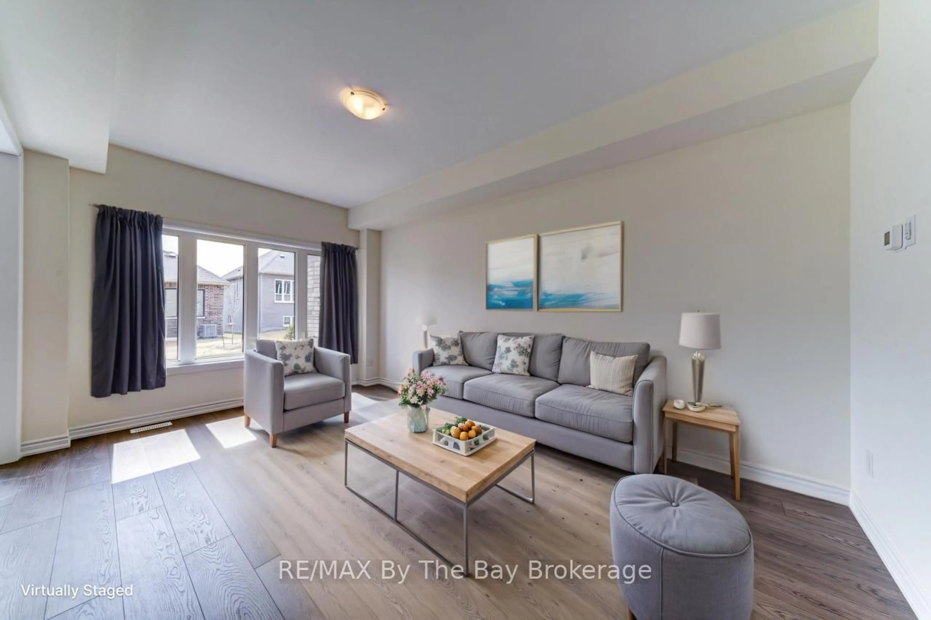 Living room with furniture, wood/laminate floor for 8 Federica Cres, Wasaga Beach Ontario L9Z 0N6