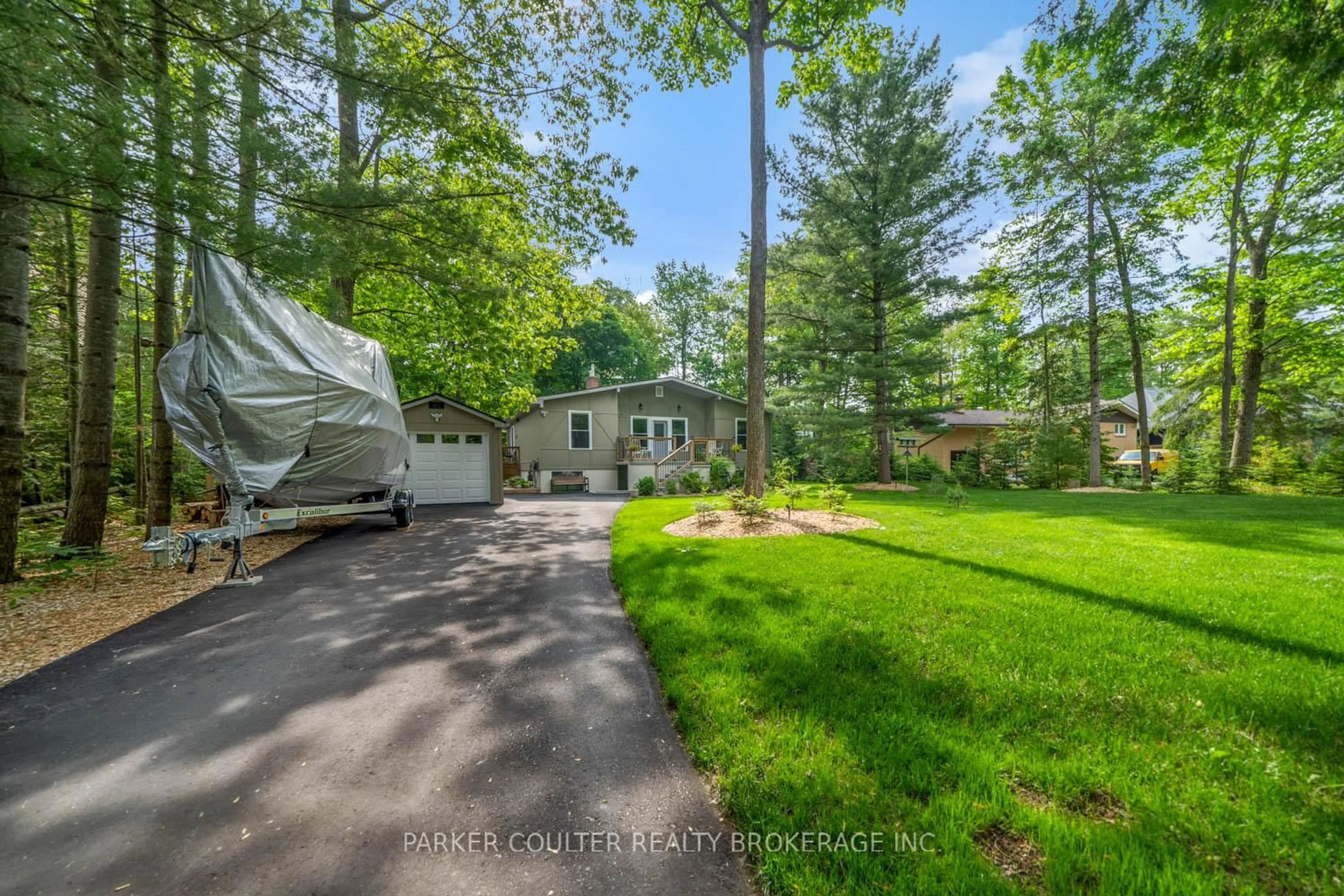 A pic from outside/outdoor area/front of a property/back of a property/a pic from drone, forest/trees view for 11 Duquette Crt, Tiny Ontario L9M 0H3