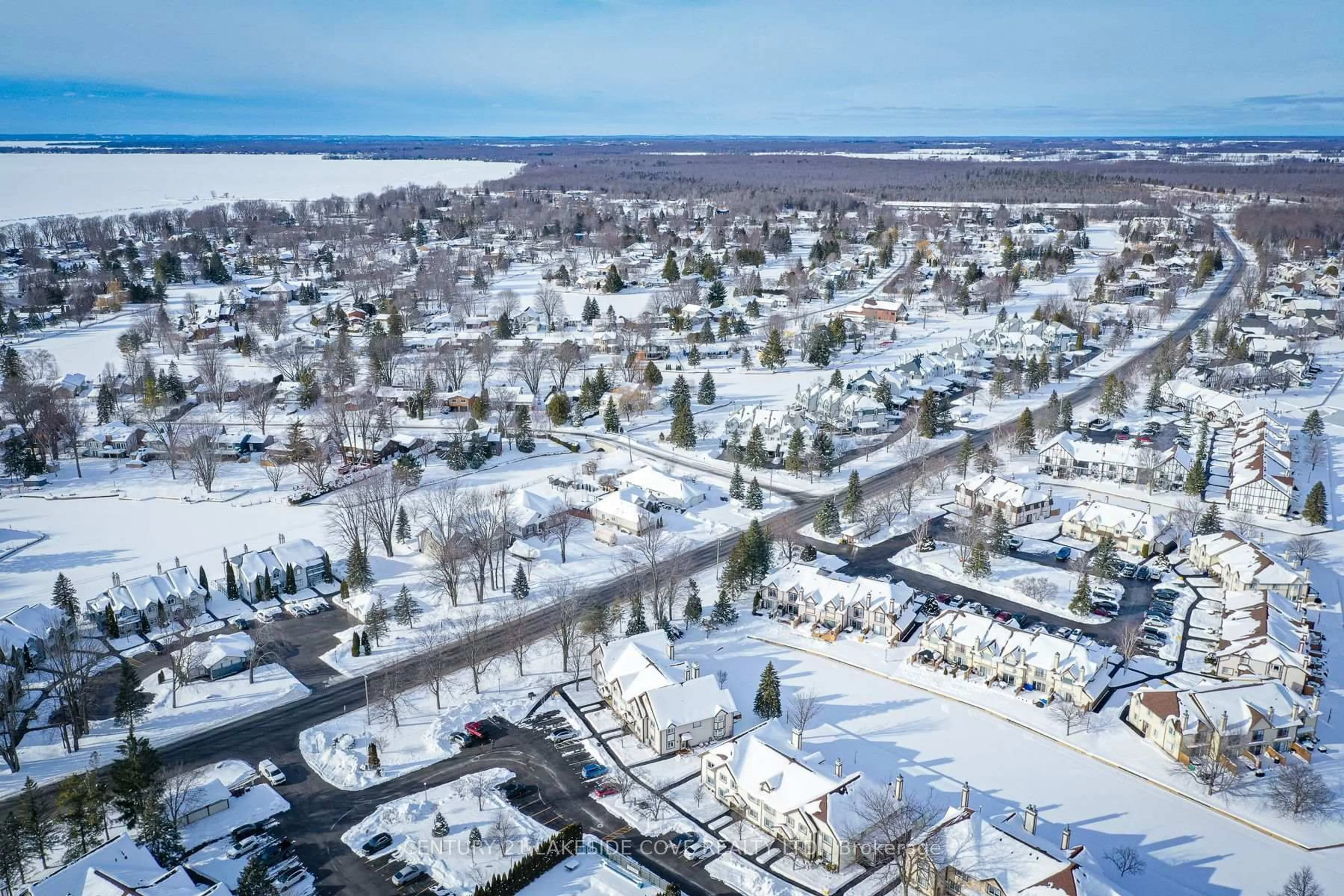 A pic from outside/outdoor area/front of a property/back of a property/a pic from drone, street for 70 Laguna Pkwy #Unit #7, Ramara Ontario L0K 1B0