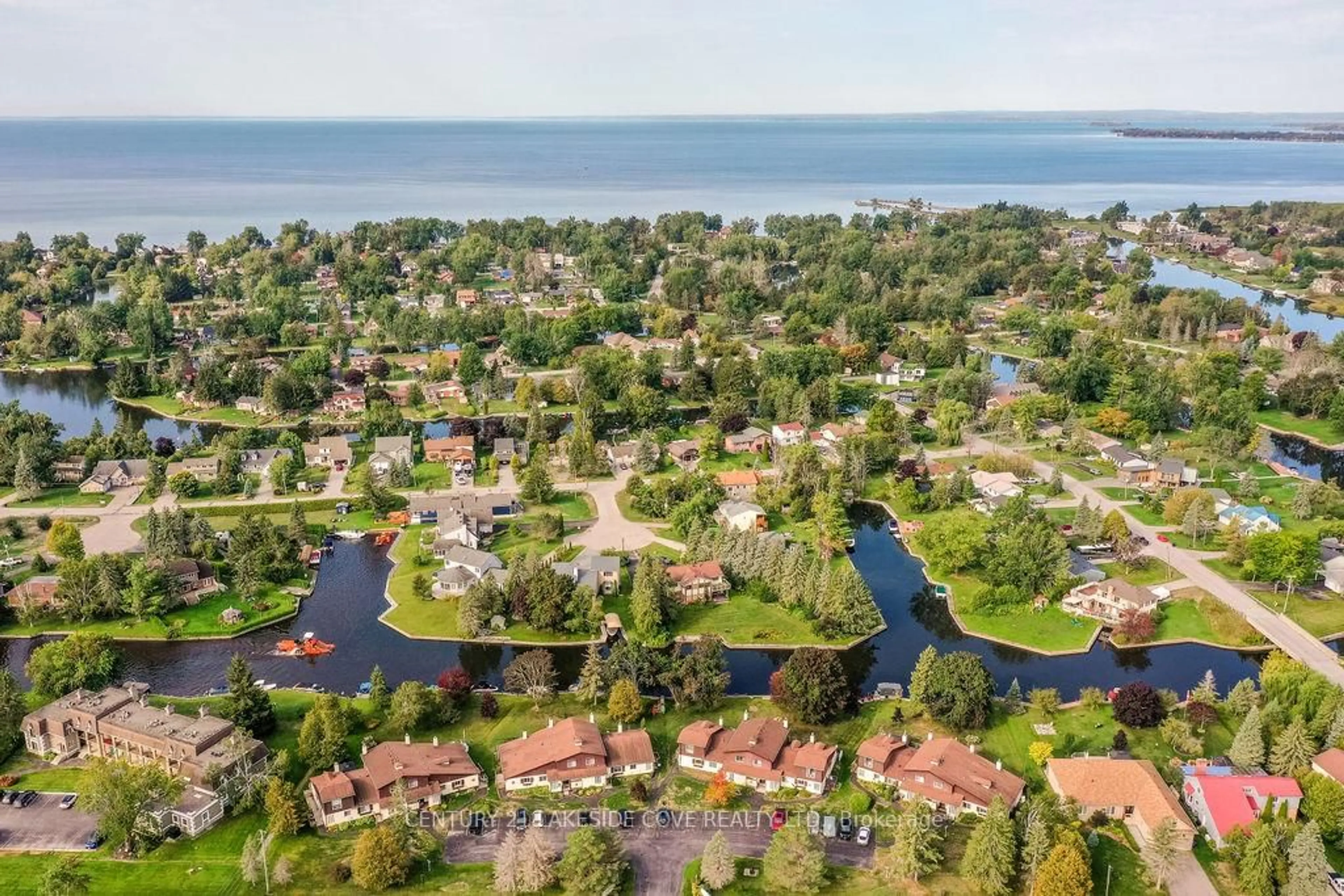 A pic from outside/outdoor area/front of a property/back of a property/a pic from drone, water/lake/river/ocean view for 70 Laguna Pkwy #Unit #7, Ramara Ontario L0K 1B0