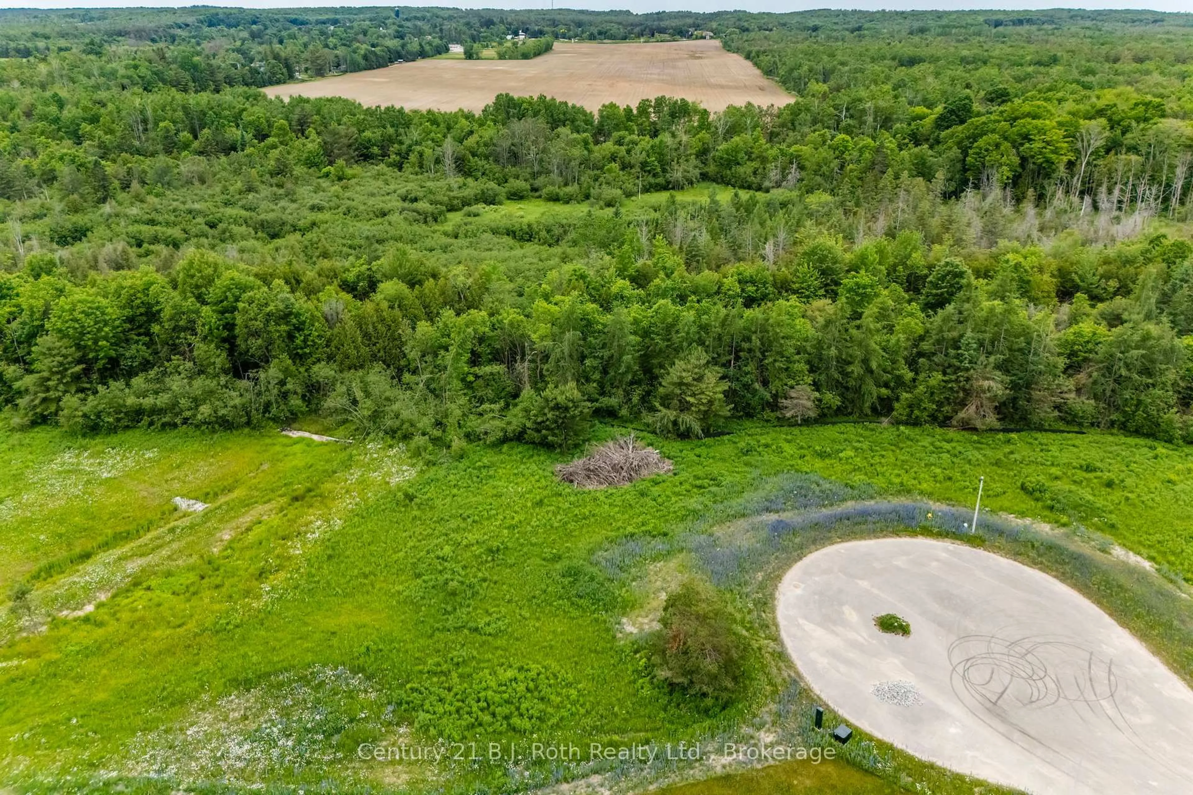 A pic from outside/outdoor area/front of a property/back of a property/a pic from drone, forest/trees view for 13 Greenlaw Crt, Springwater Ontario L0L 1V0