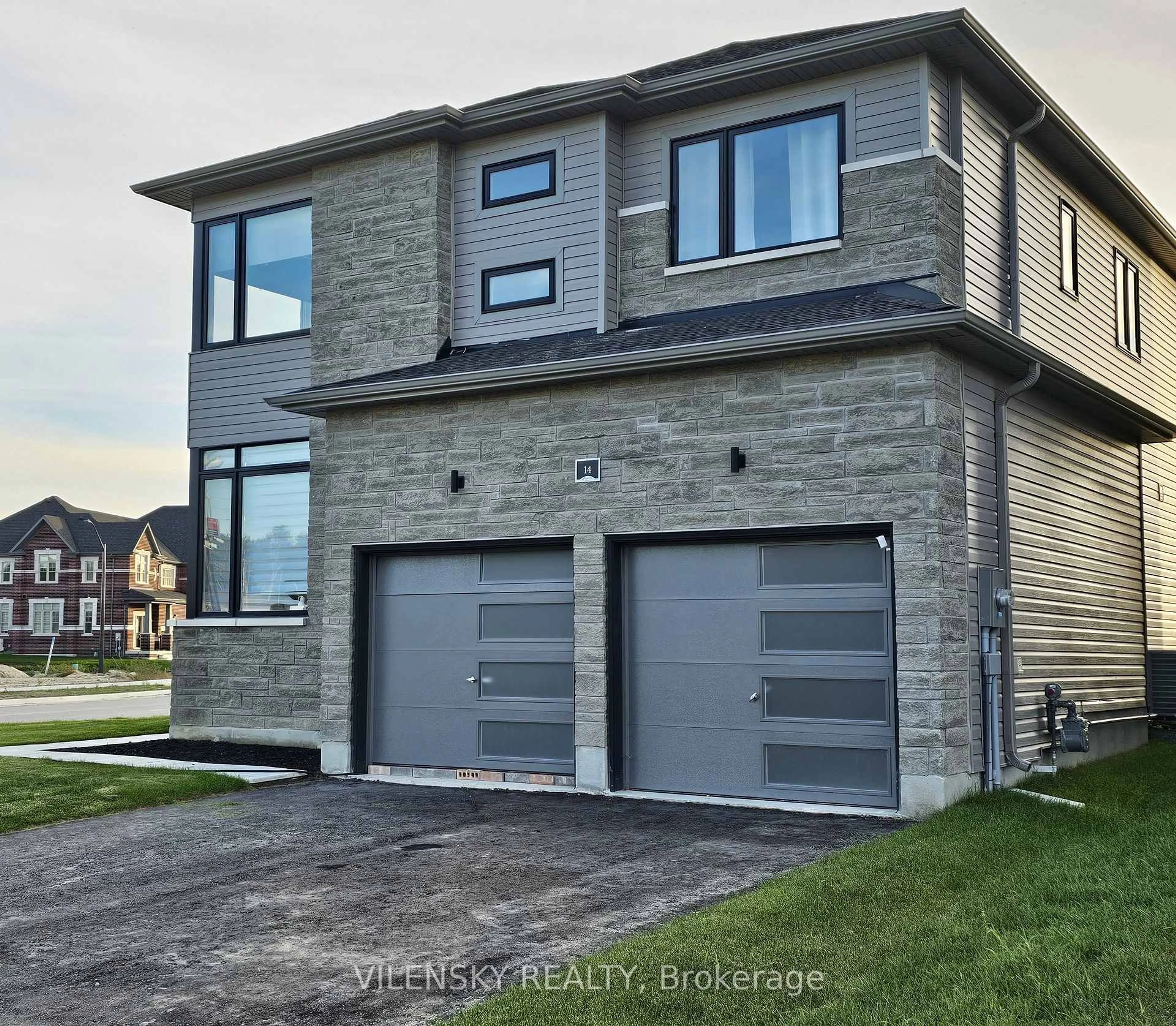 Home with brick exterior material, street for 14 TRAN St, Wasaga Beach Ontario L9Z 0M9