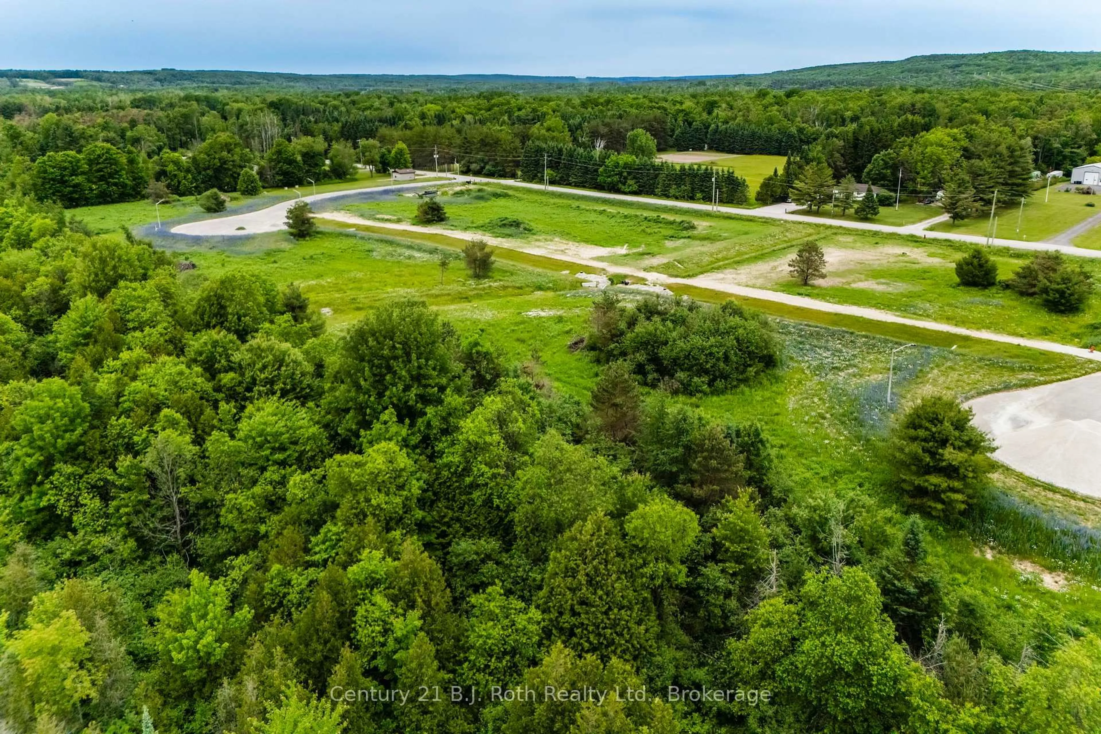A pic from outside/outdoor area/front of a property/back of a property/a pic from drone, forest/trees view for 4 RUMBLE Crt, Springwater Ontario L0L 1V0