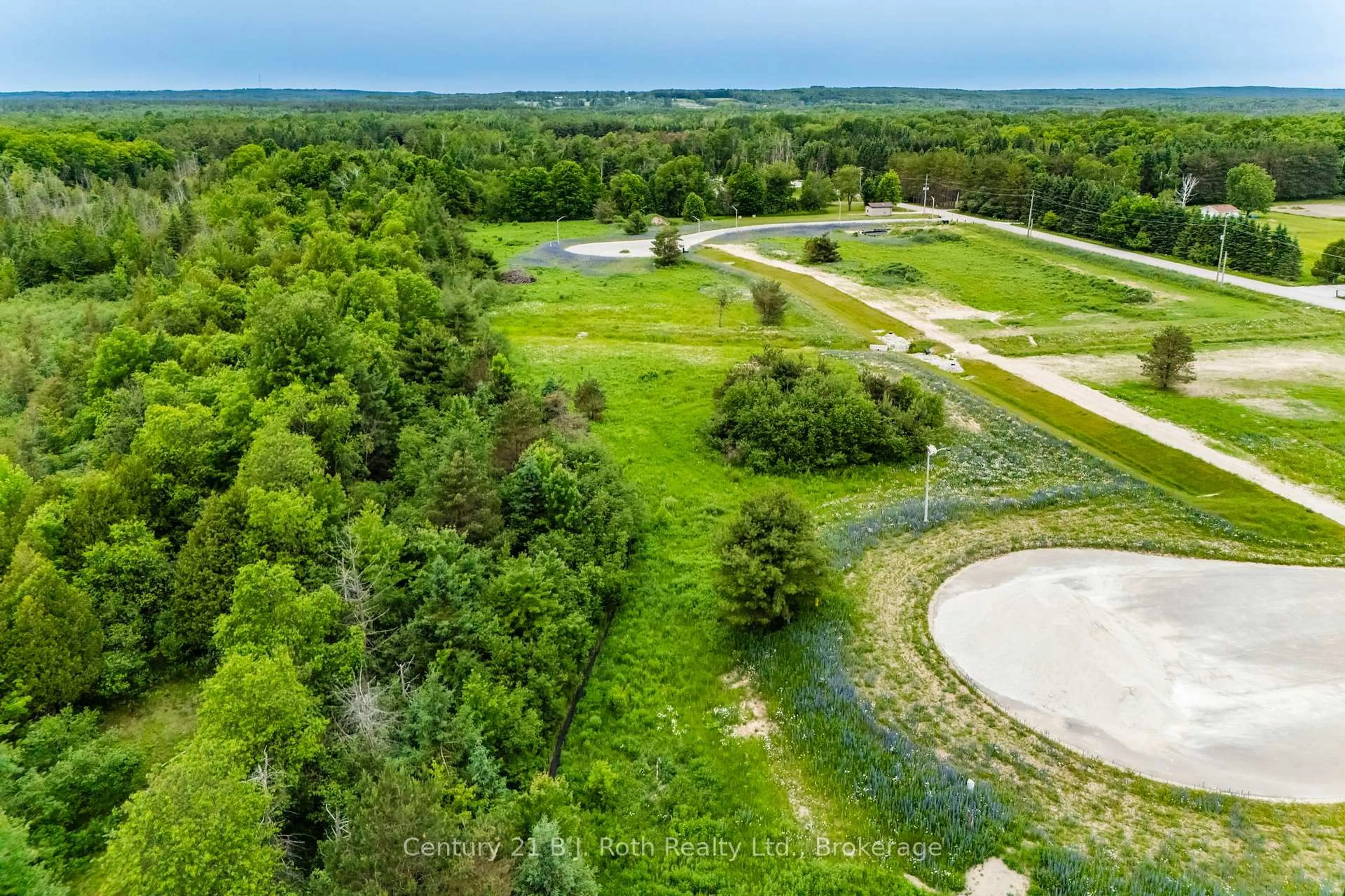 A pic from outside/outdoor area/front of a property/back of a property/a pic from drone, forest/trees view for 4 RUMBLE Crt, Springwater Ontario L0L 1V0