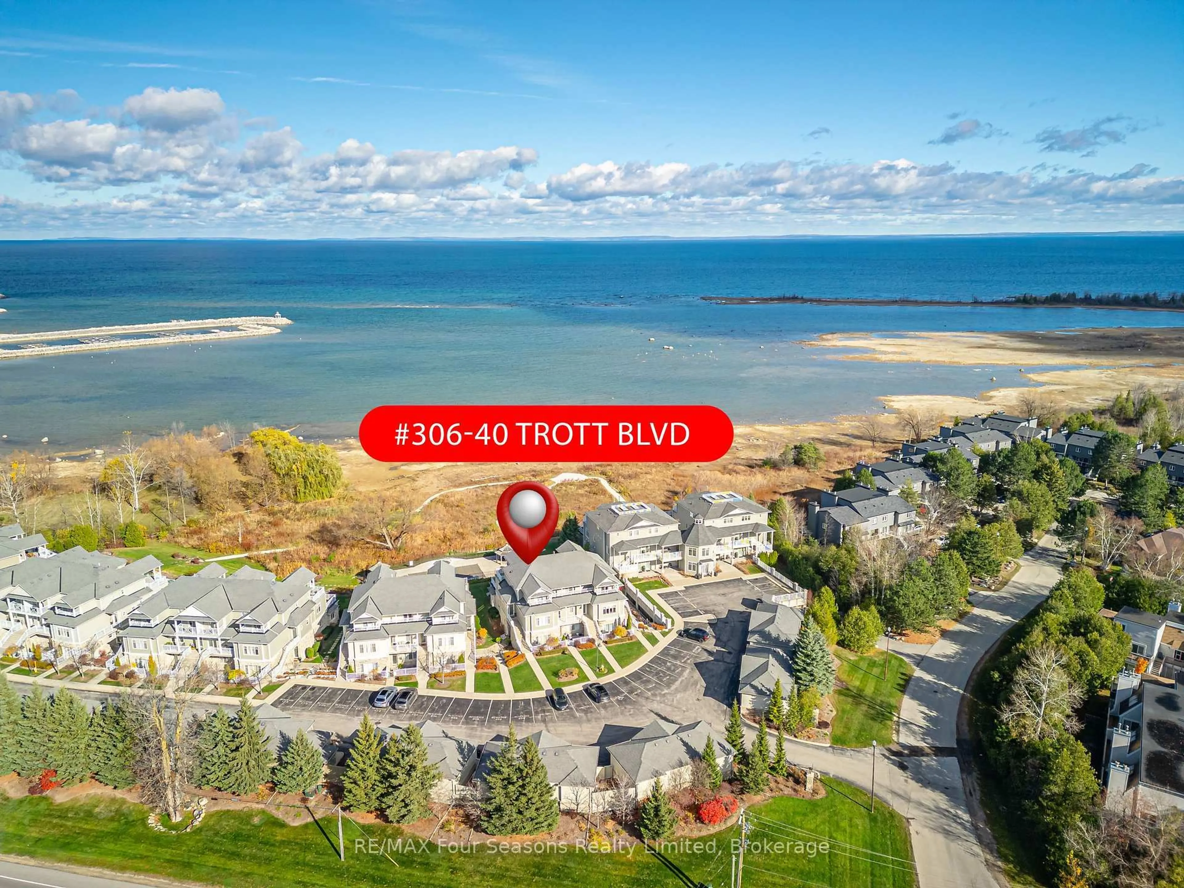 A pic from outside/outdoor area/front of a property/back of a property/a pic from drone, water/lake/river/ocean view for 40 Trott Blvd #306, Collingwood Ontario L9Y 5K5