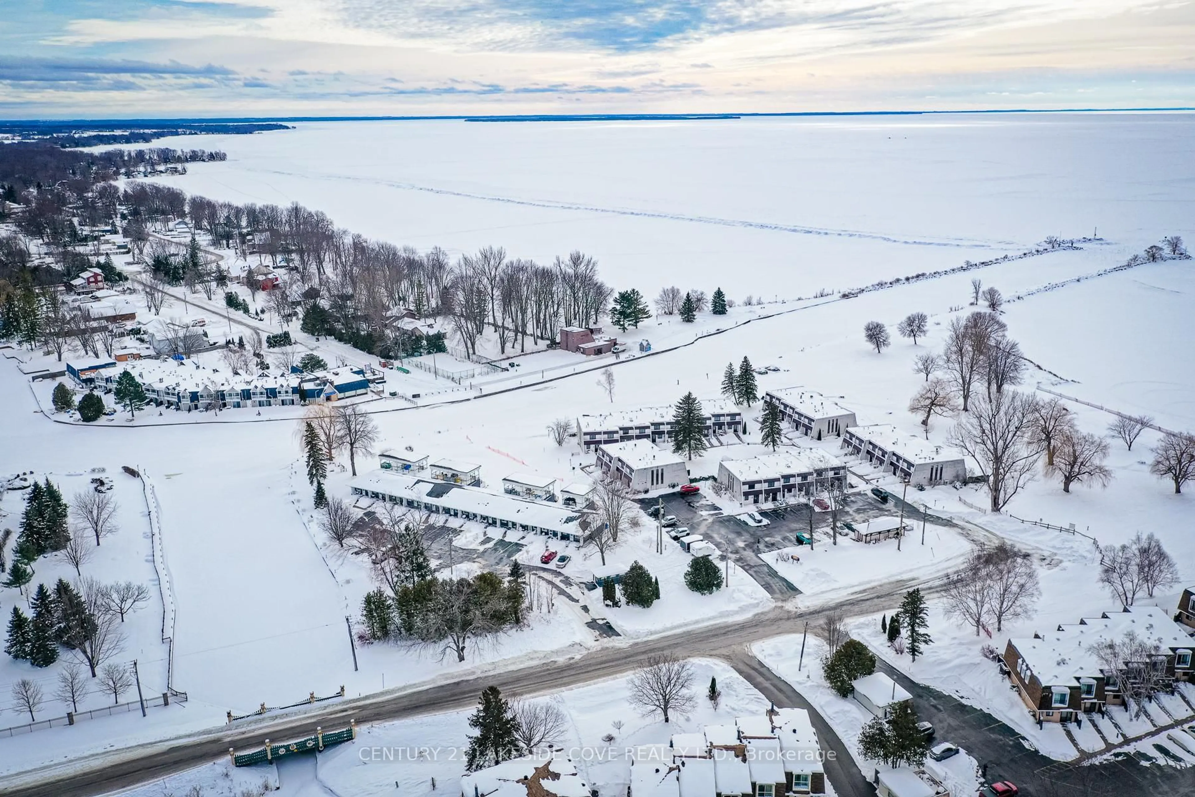 A pic from outside/outdoor area/front of a property/back of a property/a pic from drone, water/lake/river/ocean view for 1 Paradise Blvd #Unit 14, Ramara Ontario L0K 1B0