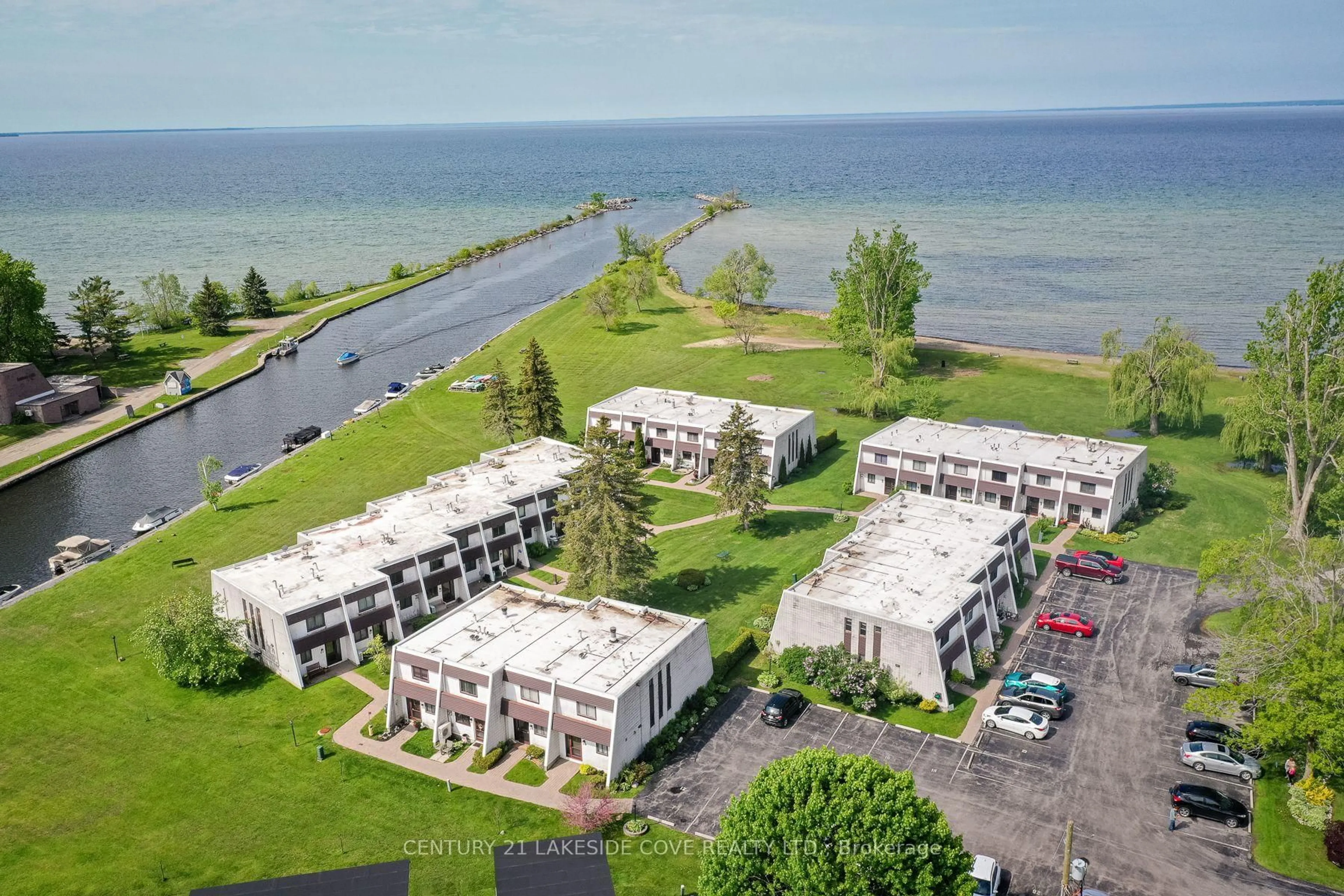 A pic from outside/outdoor area/front of a property/back of a property/a pic from drone, water/lake/river/ocean view for 1 Paradise Blvd #Unit 14, Ramara Ontario L0K 1B0