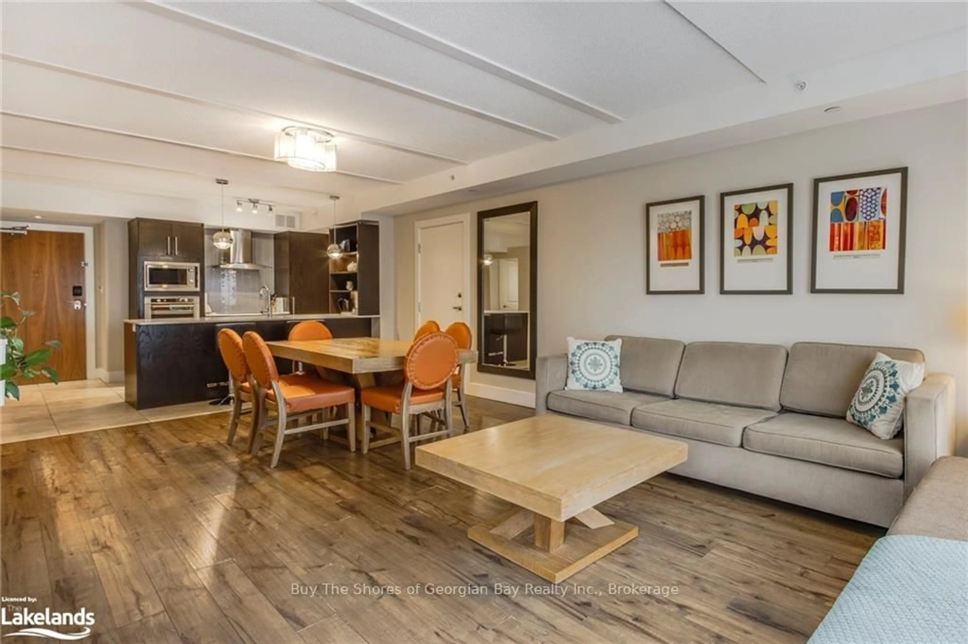 Living room with furniture, wood/laminate floor for 9 HARBOUR St #6201-03, Collingwood Ontario L9Y 5C5