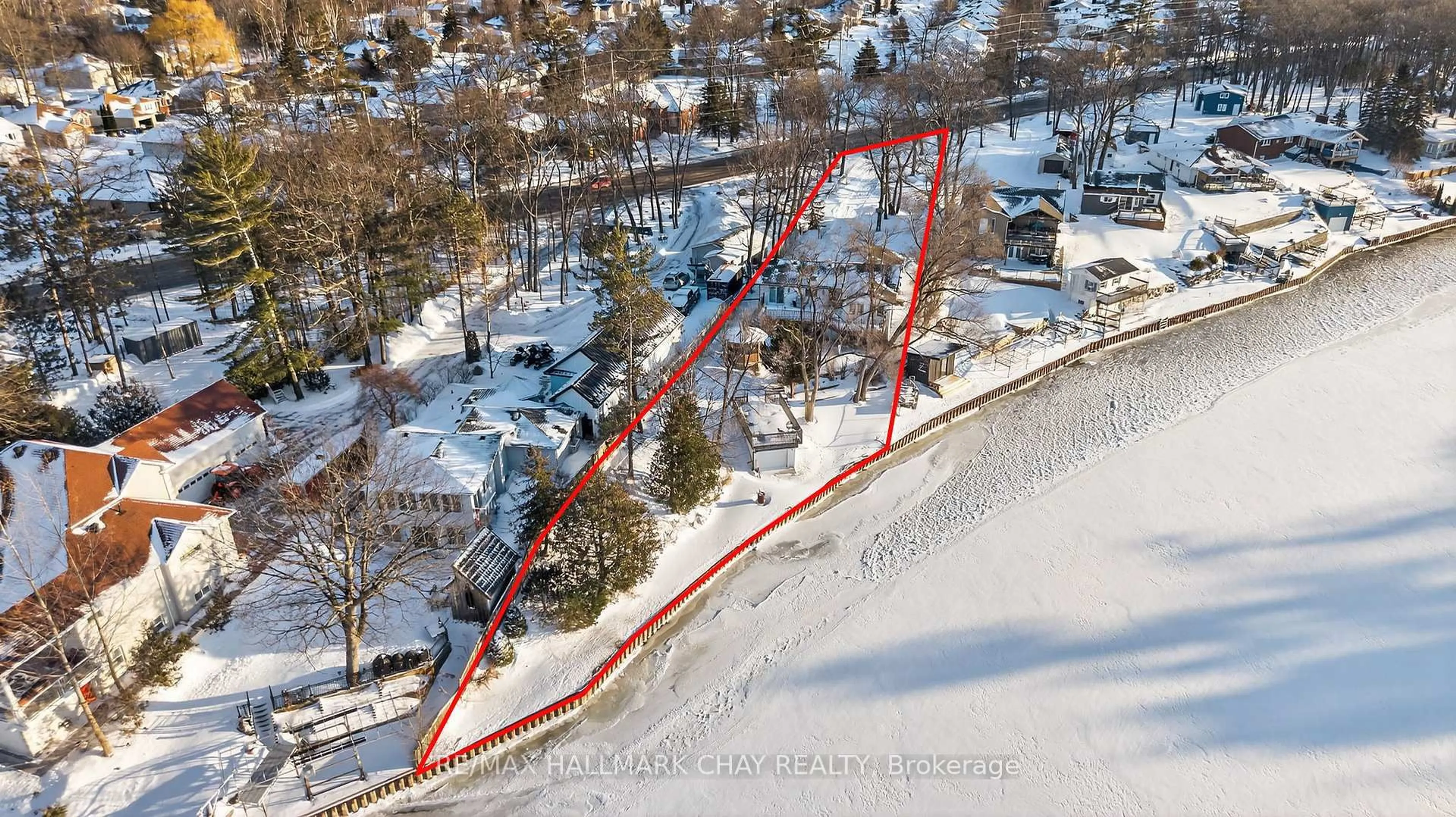 A pic from outside/outdoor area/front of a property/back of a property/a pic from drone, street for 1976 River Rd, Wasaga Beach Ontario L9Z 2W2