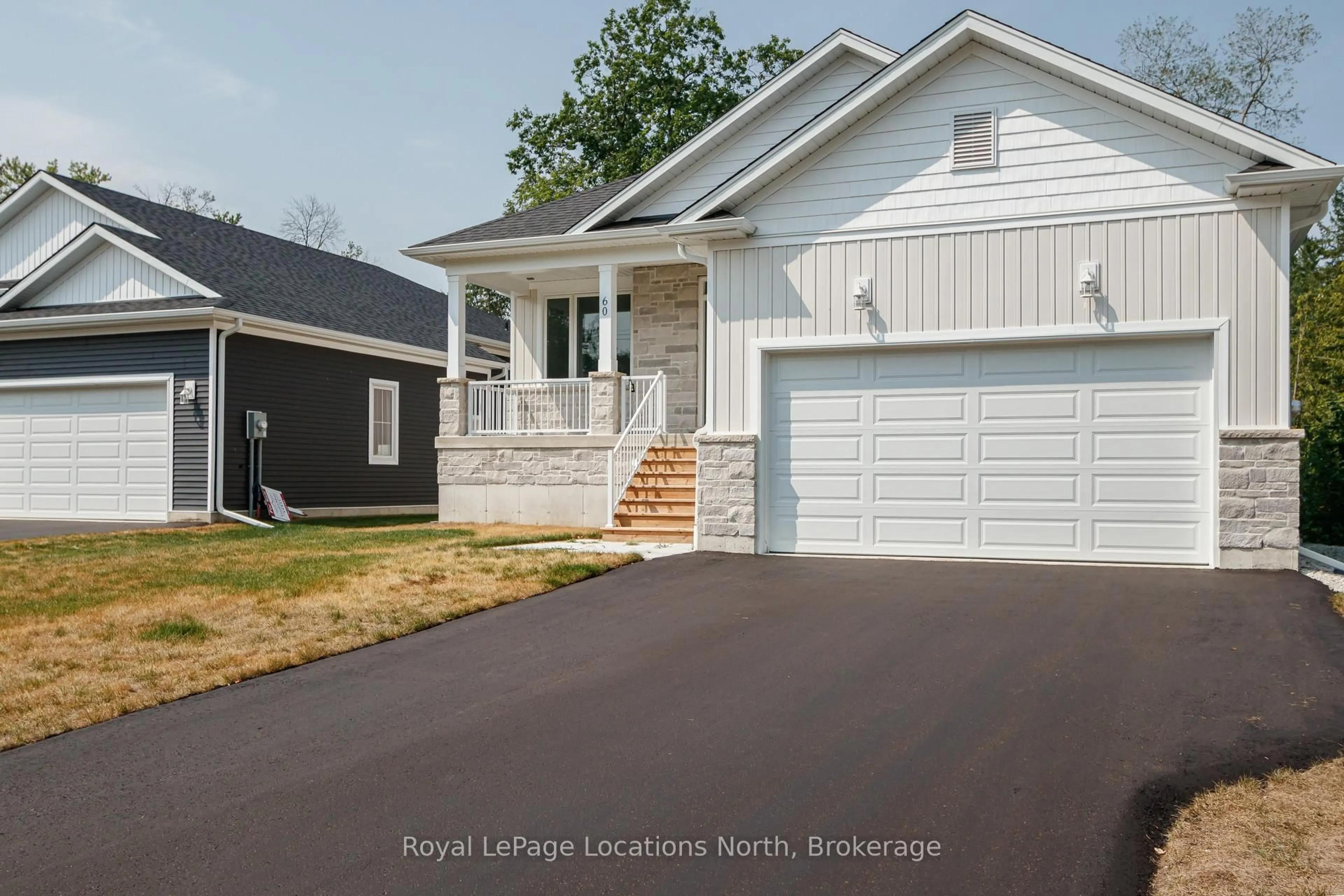 Home with vinyl exterior material, street for 60 52nd St, Wasaga Beach Ontario L0M 1P0