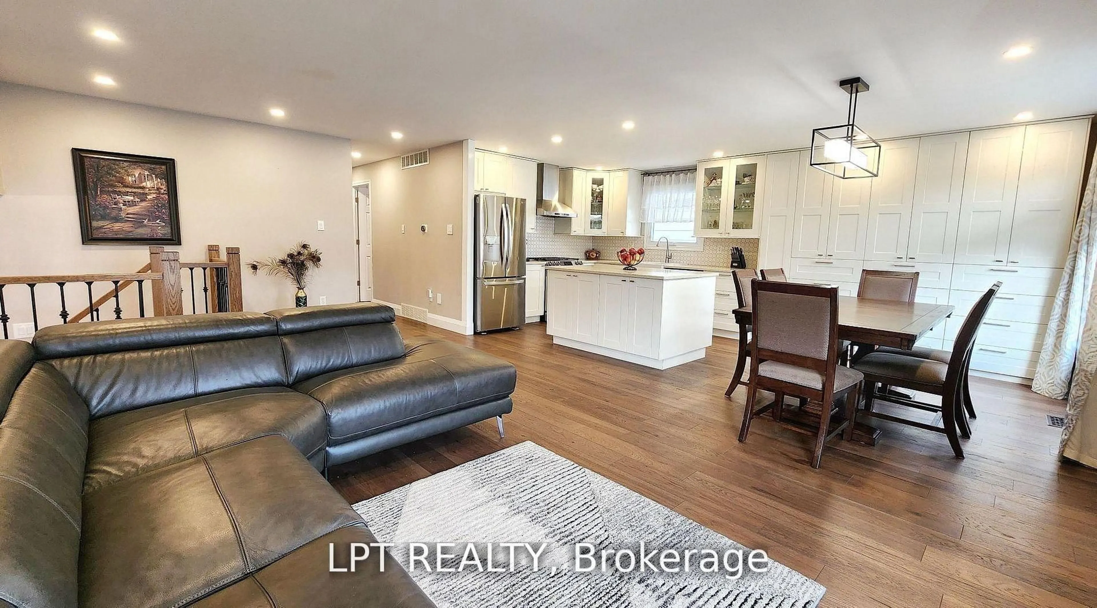 Open concept kitchen, wood/laminate floor for 48 Maplehurst Cres, Barrie Ontario L4M 4X2