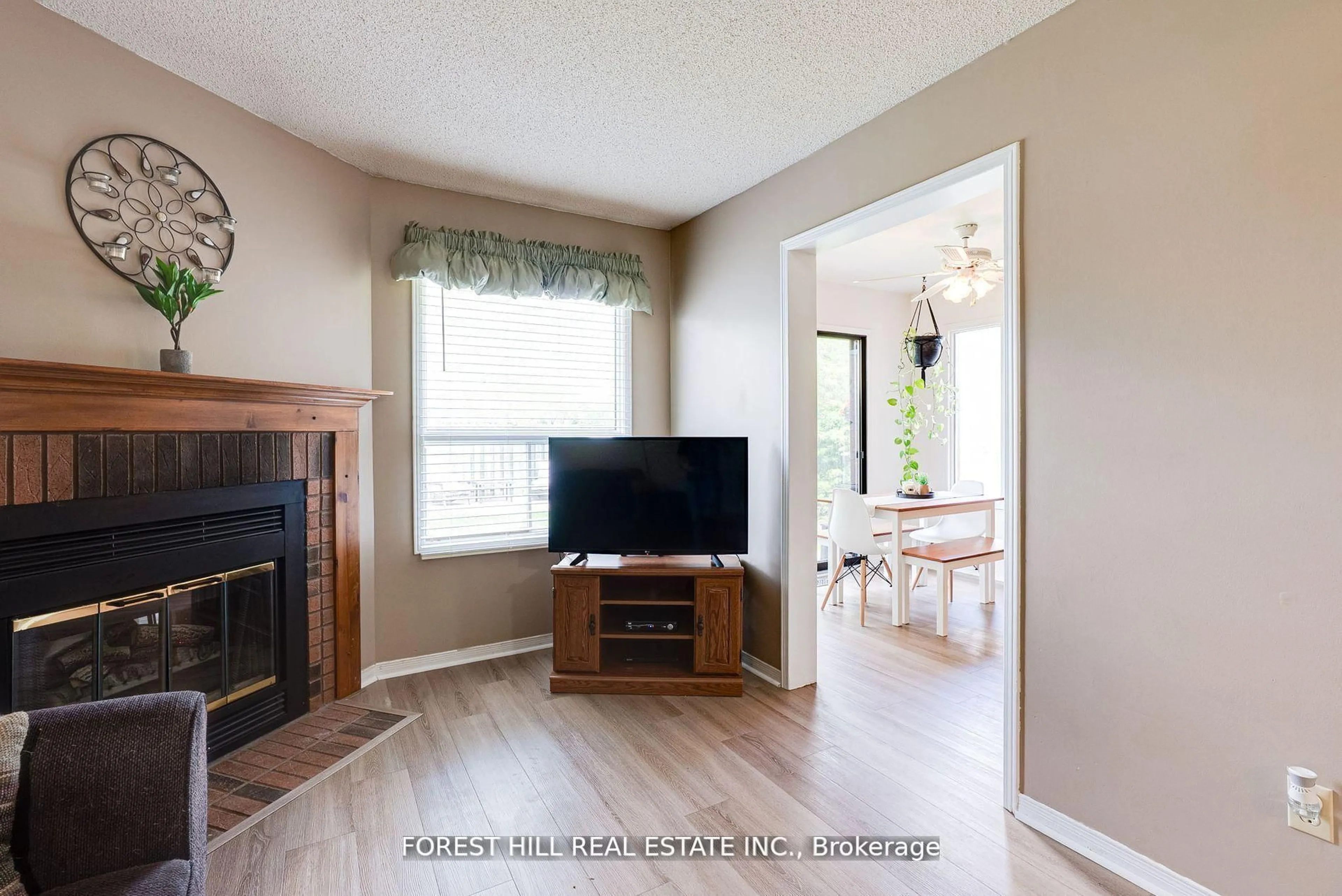 Living room with furniture, wood/laminate floor for 44 Quance St, Barrie Ontario L4N 7M3