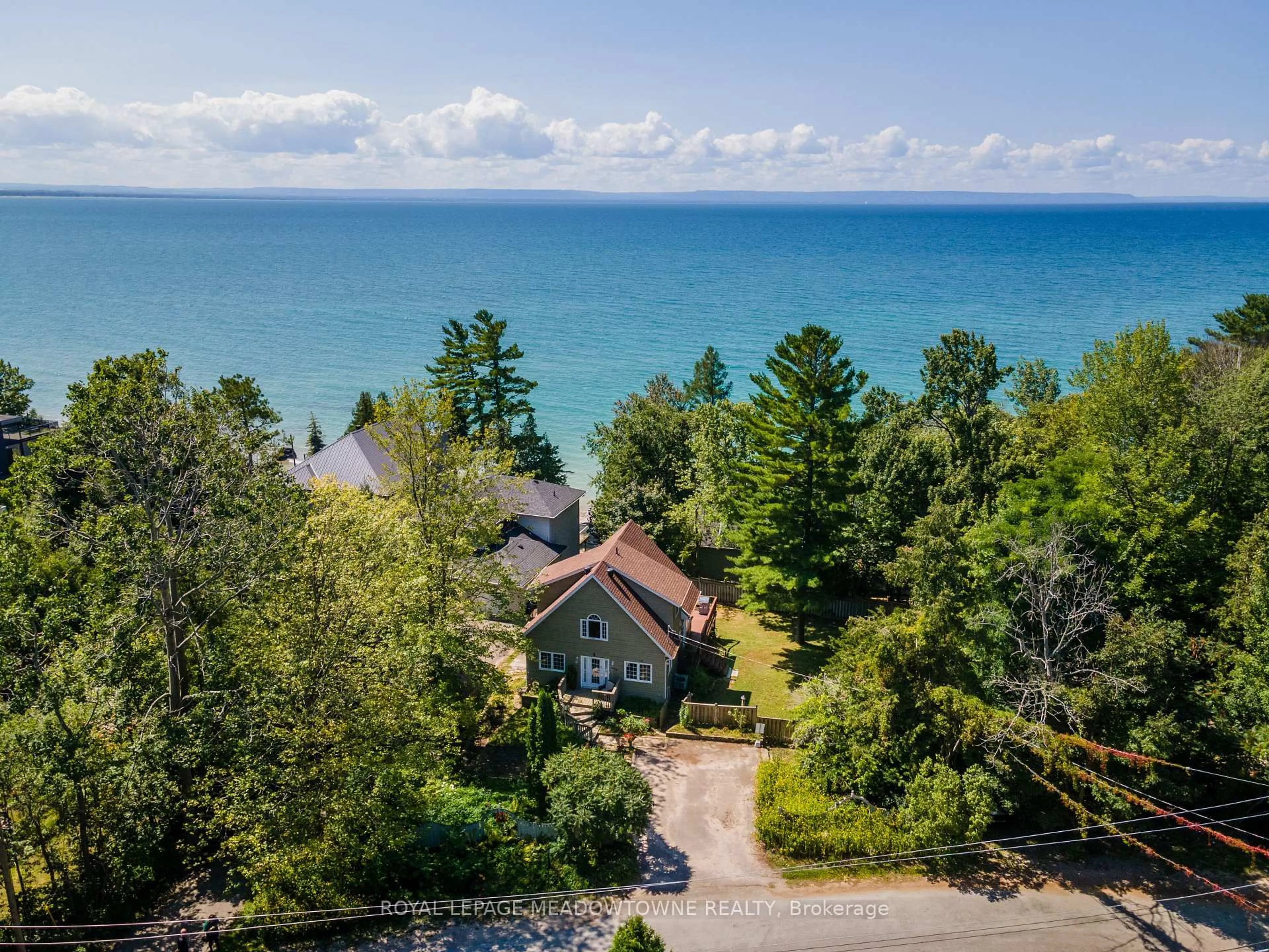 A pic from outside/outdoor area/front of a property/back of a property/a pic from drone, water/lake/river/ocean view for 1936 Tiny Beaches Rd, Tiny Ontario L0L 1P0