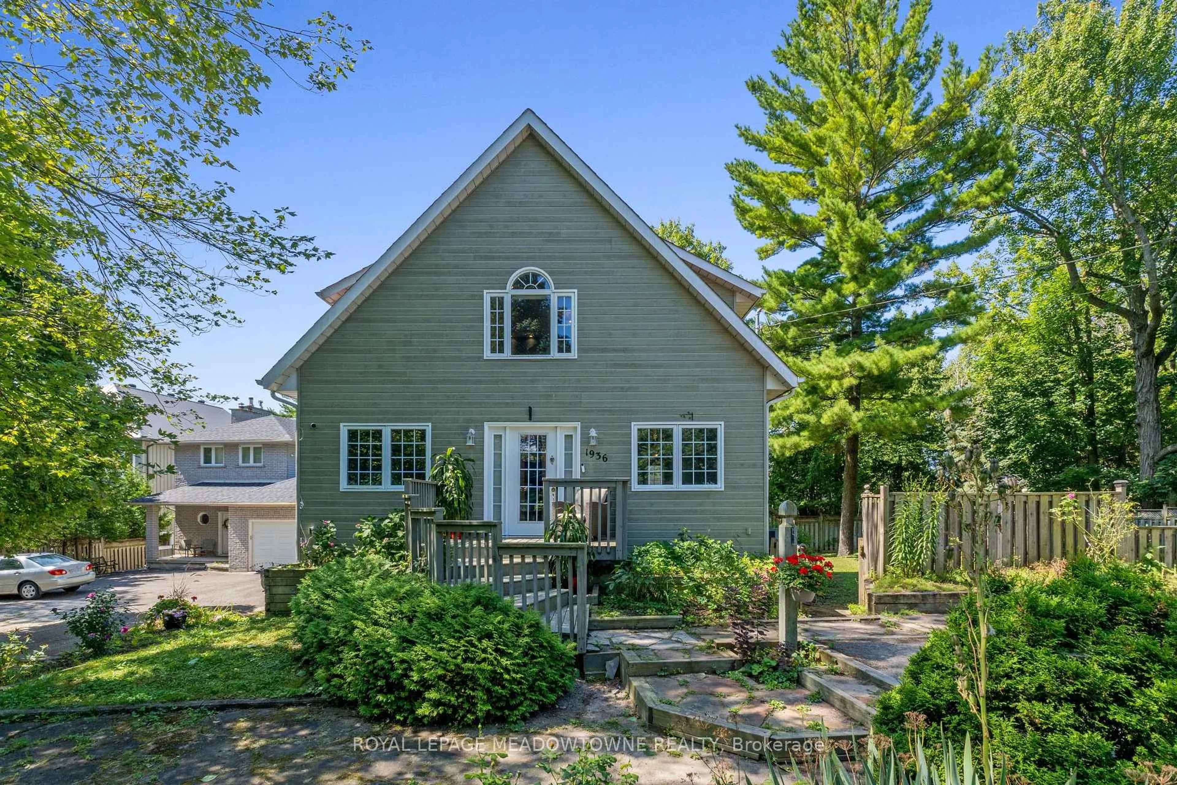 Home with vinyl exterior material, street for 1936 Tiny Beaches Rd, Tiny Ontario L0L 1P0