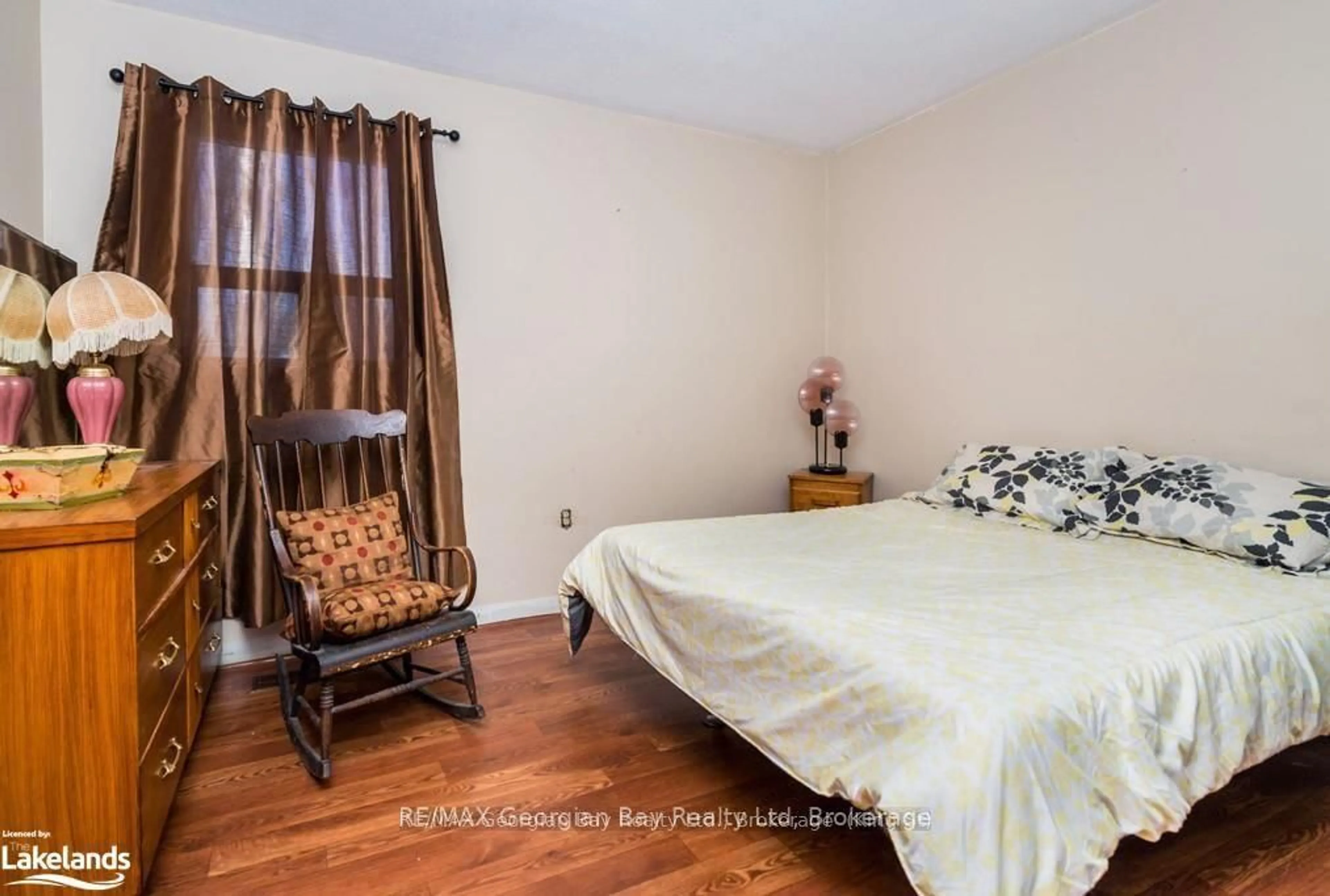 Bedroom with bed, wood/laminate floor for 9513 County Rd 93 Rd, Midland Ontario L4R 5K6