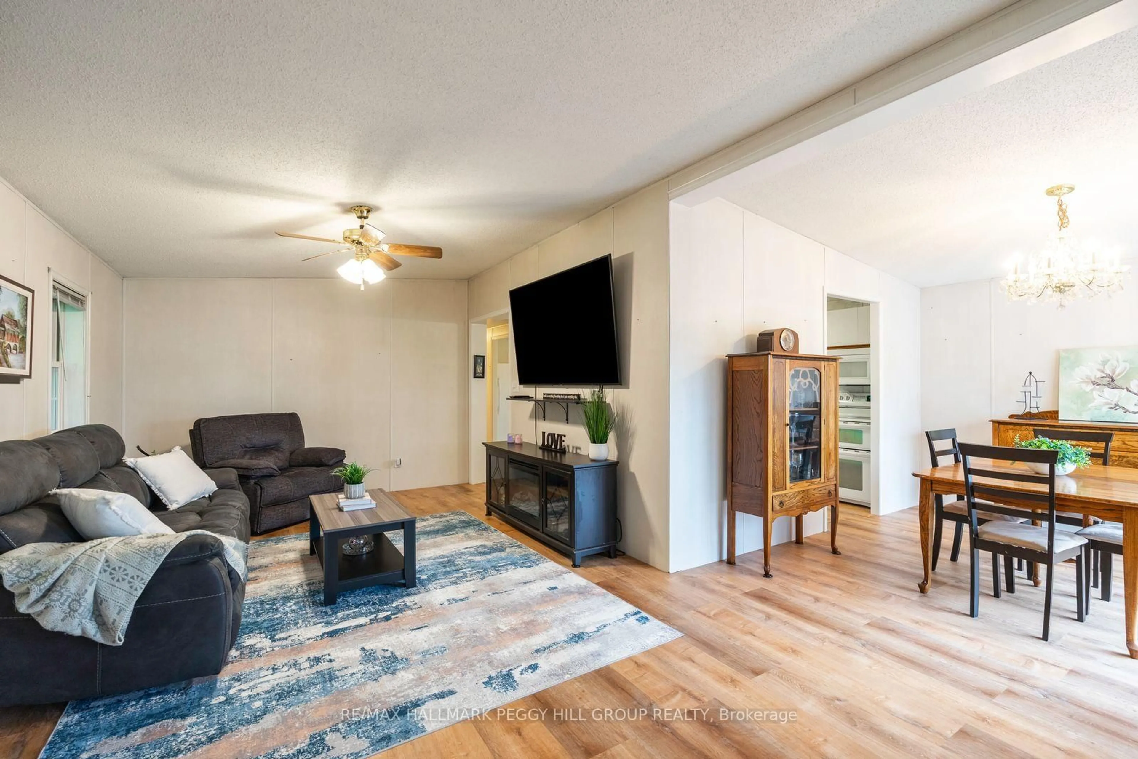 Living room with furniture, wood/laminate floor for 30 Jane St, Oro-Medonte Ontario L3V 0P9