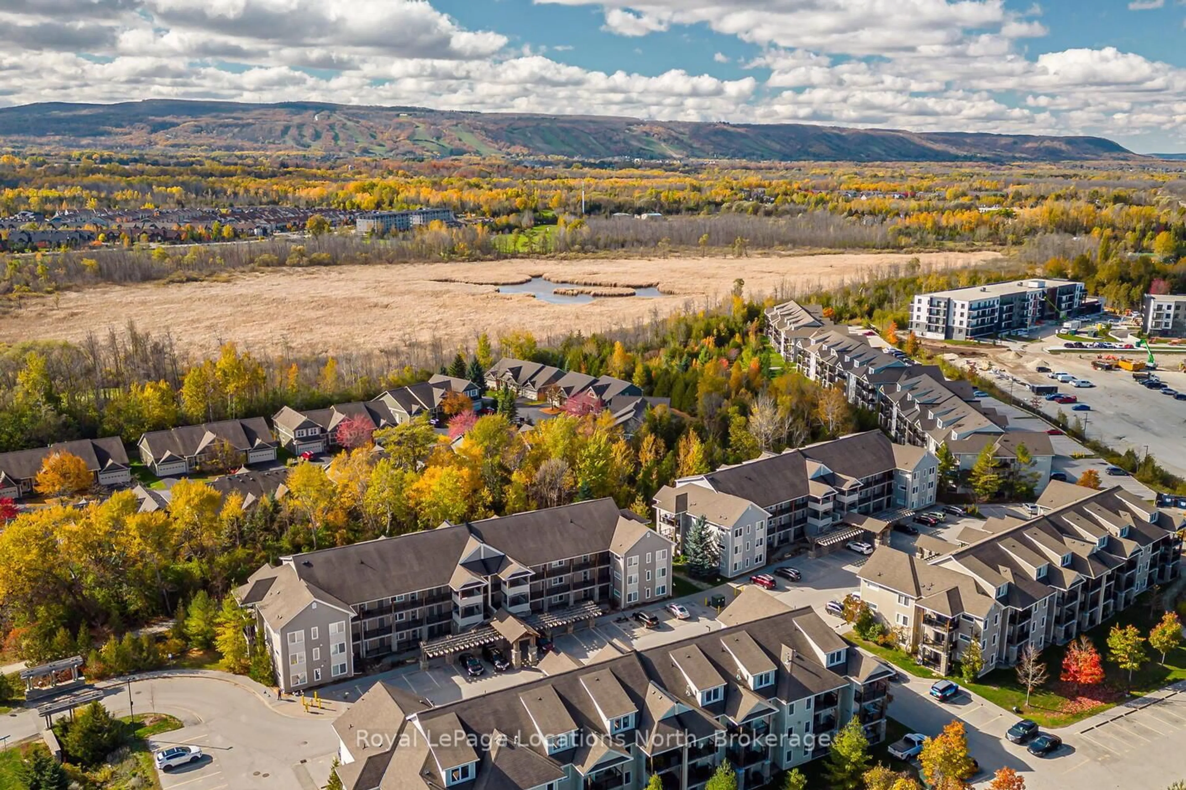 A pic from outside/outdoor area/front of a property/back of a property/a pic from drone, mountain view for 1 BRANDY LANE Dr #102, Collingwood Ontario L9Y 0X4