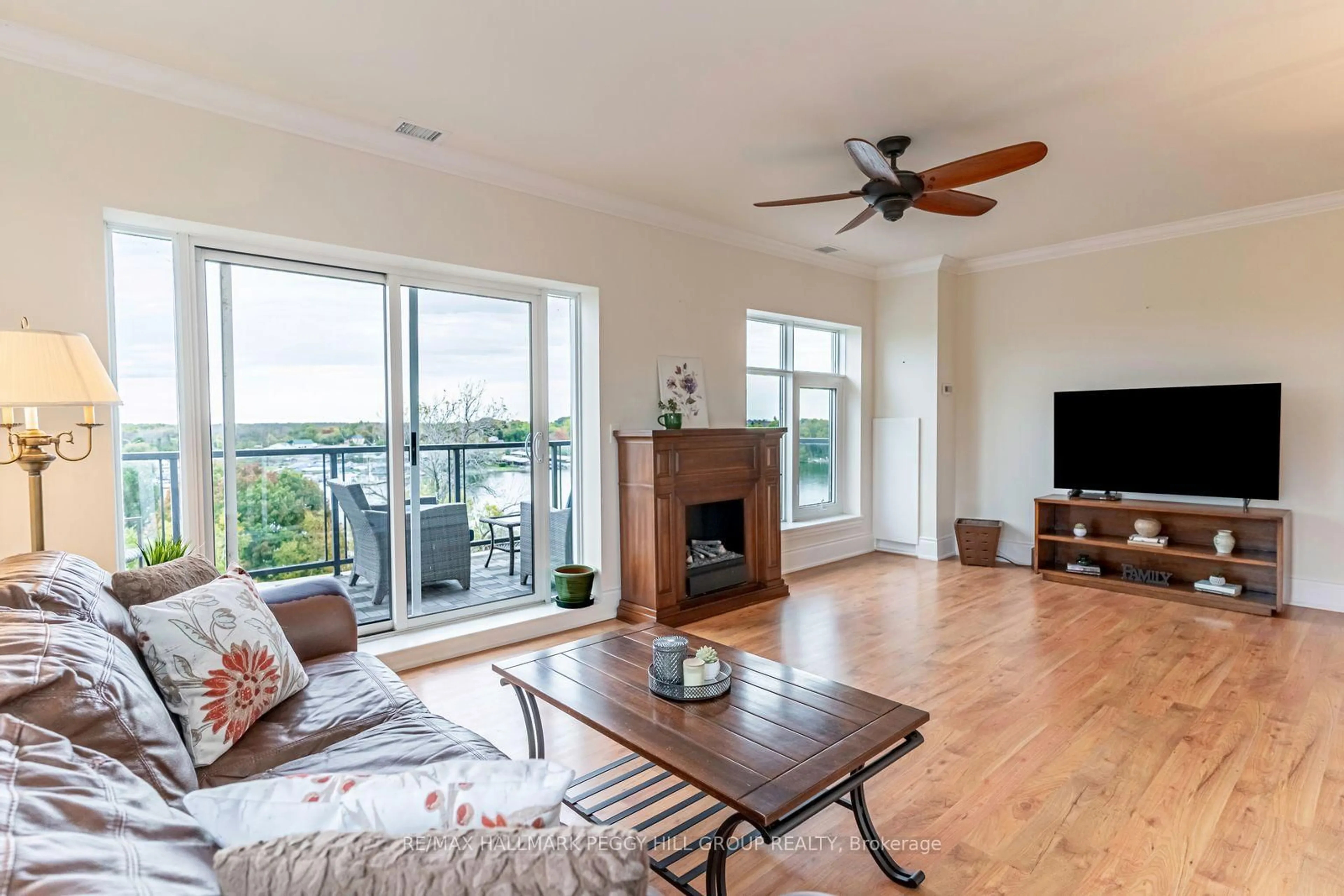 Living room with furniture, wood/laminate floor for 80 Orchard Point Rd #604, Orillia Ontario L3V 1C6