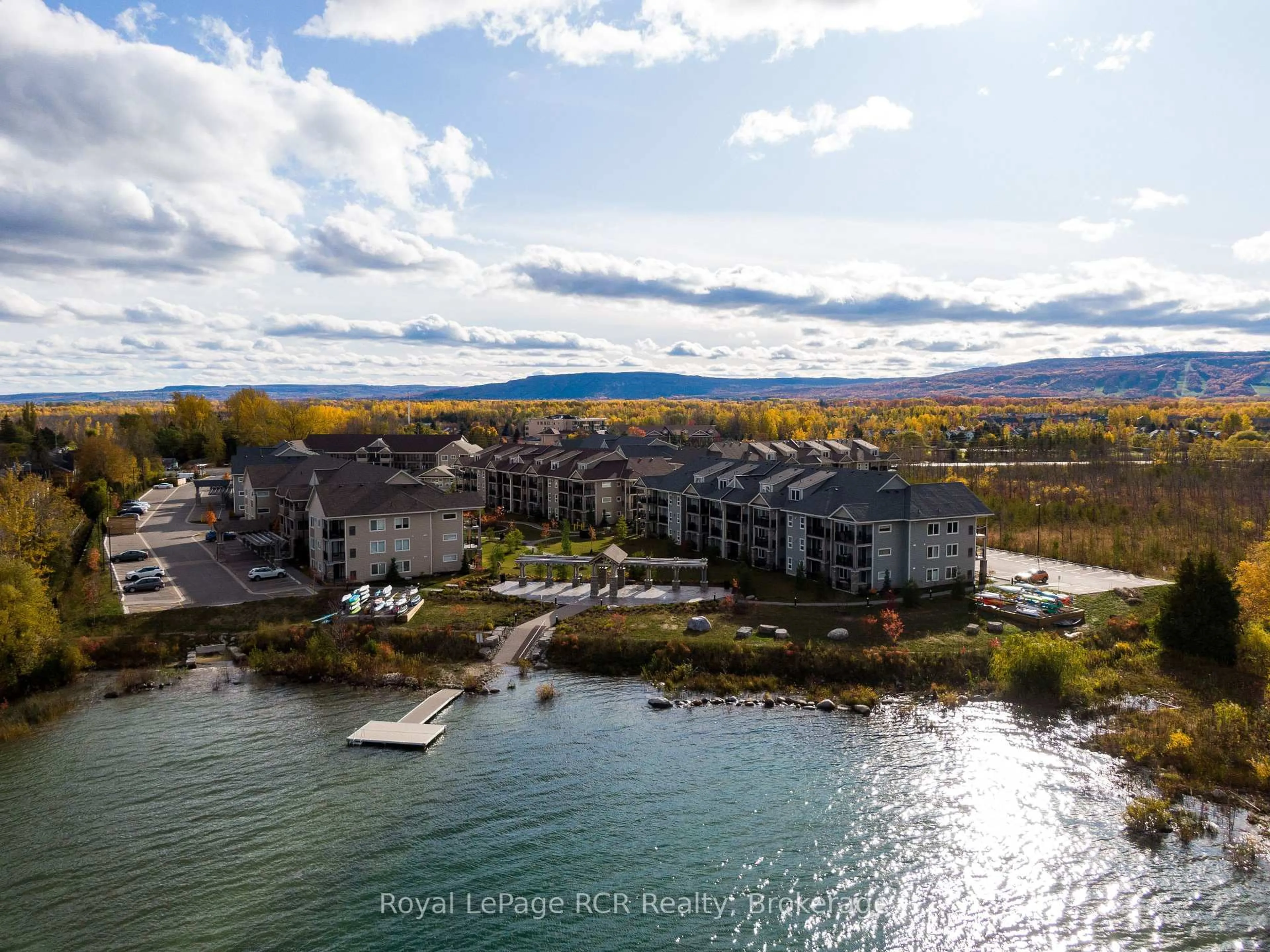 A pic from outside/outdoor area/front of a property/back of a property/a pic from drone, water/lake/river/ocean view for 2 COVE Crt #205, Collingwood Ontario L9Y 0Y6