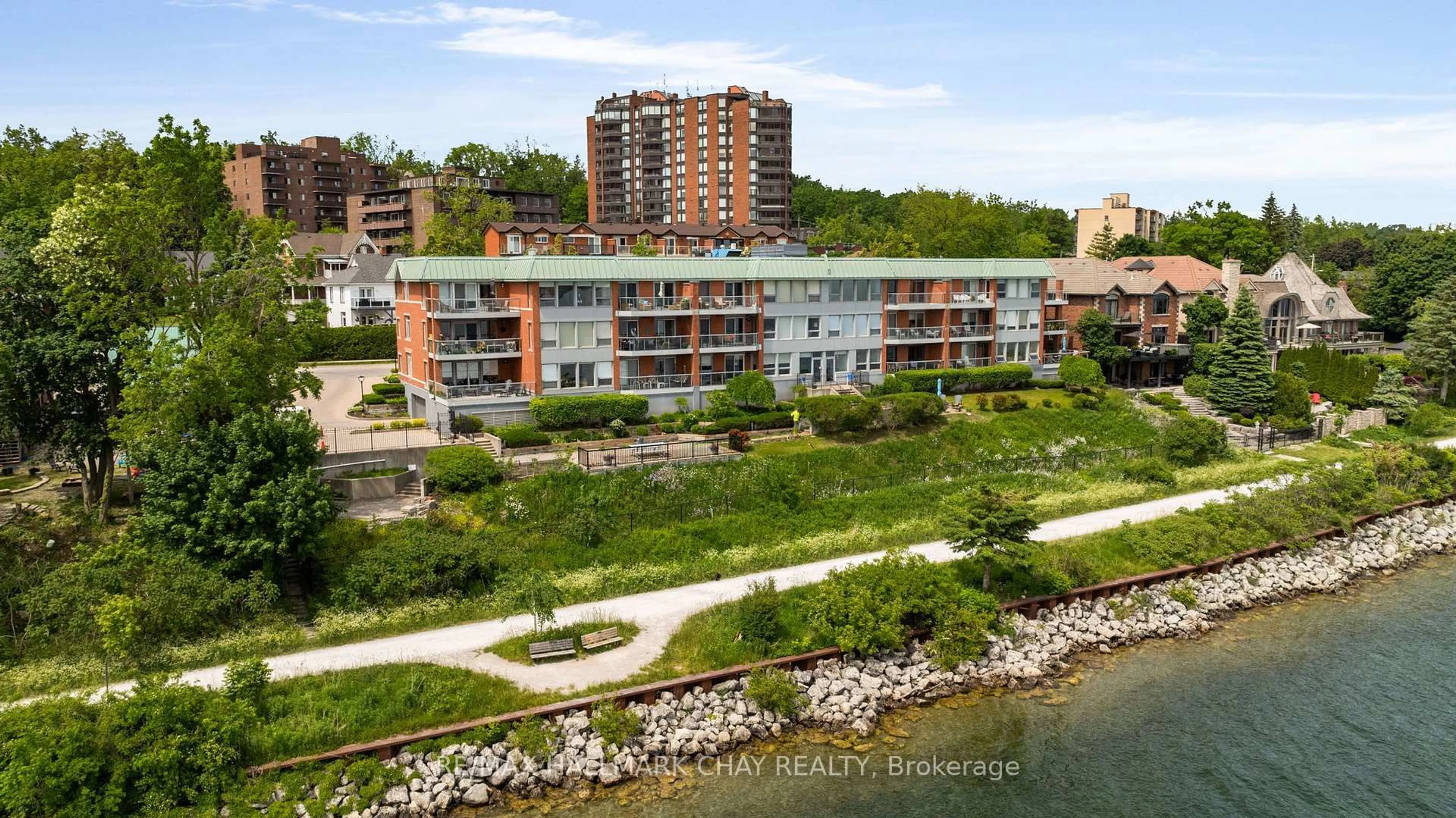 A pic from outside/outdoor area/front of a property/back of a property/a pic from drone, water/lake/river/ocean view for 21 Kempenfelt Dr #103, Barrie Ontario L4M 1B8