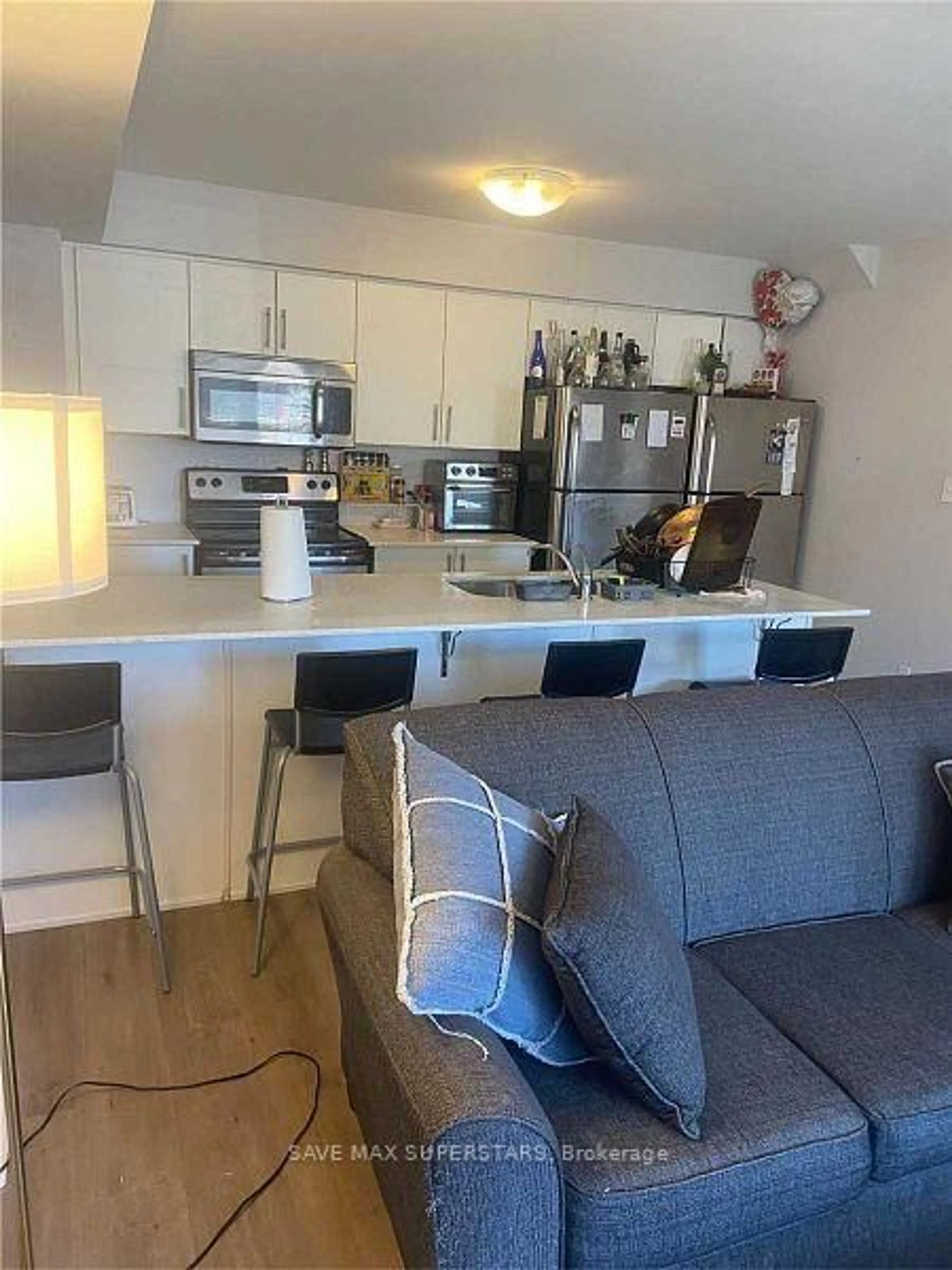 Open concept kitchen, wood/laminate floor for 246 Penetanguishene Rd #9, Barrie Ontario L4M 7C2