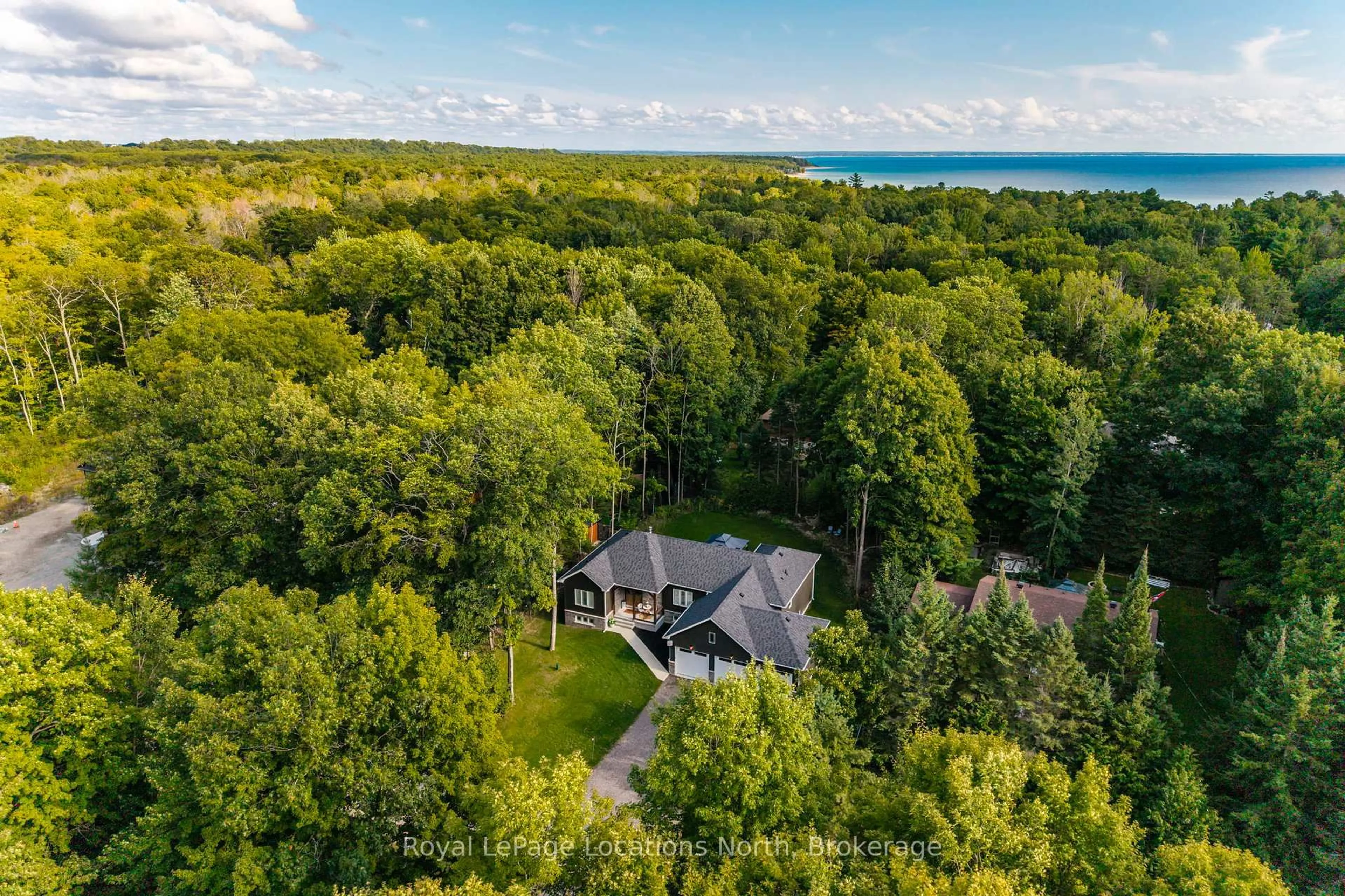 A pic from outside/outdoor area/front of a property/back of a property/a pic from drone, water/lake/river/ocean view for 15 Pinecone Ave, Tiny Ontario L9M 0J2